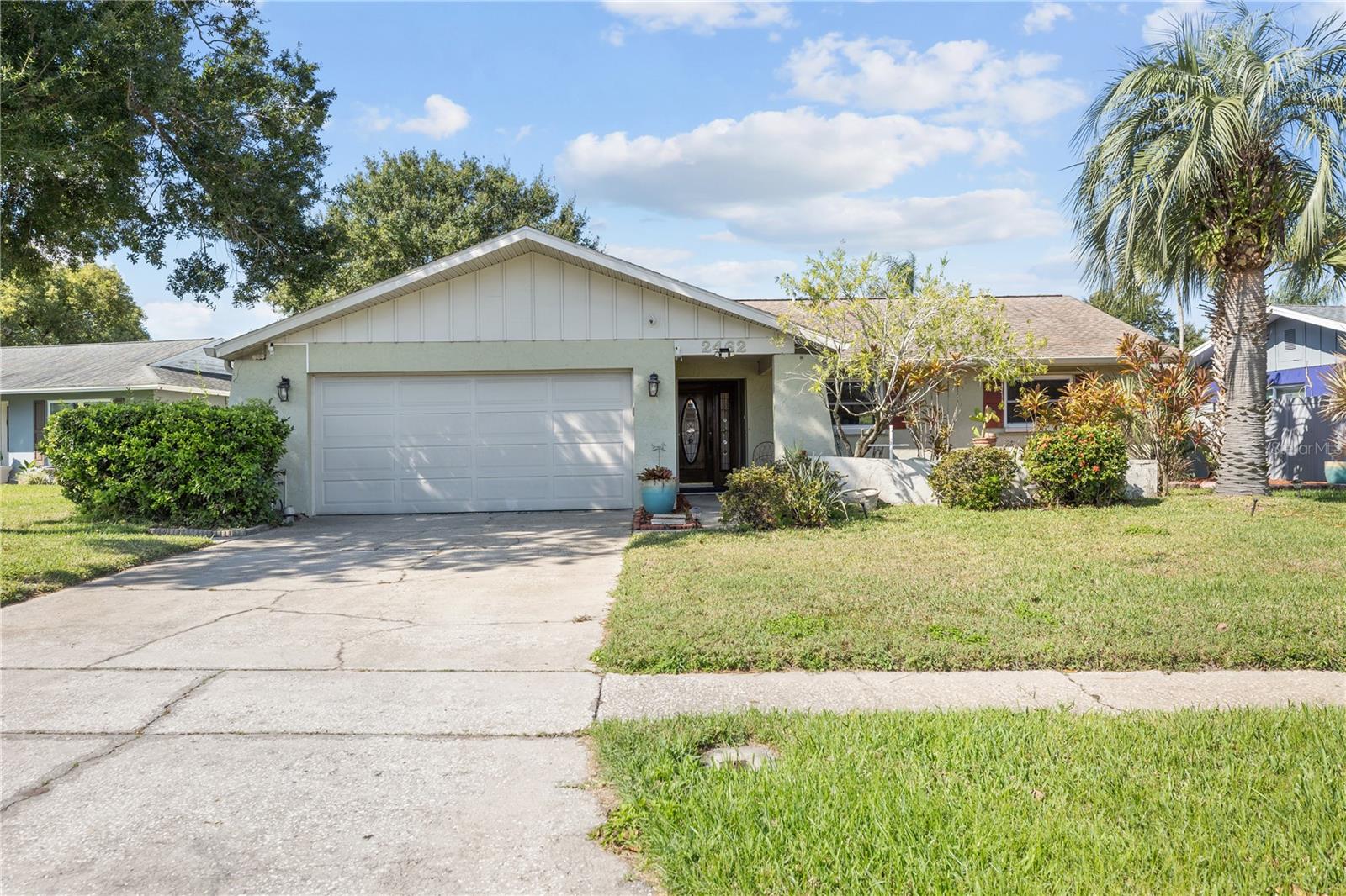 Discover this rare gem in one of Clearwater’s most sought-after neighborhoods — perfectly positioned across from a beautiful, expansive park and UNDER APPRAISED MARKET VALUE! This 3 bed/ 2 bath home offers the perfect balance of style, comfort, and convenience, wrapped in a beautifully maintained property with updates in all the right places while being ready for your personal touch.
From the moment you arrive, the large entryway and stunning solid wood front door set the tone for what lies inside. Step into a spacious, light-filled interior featuring a dramatic brick, wood-burning fireplace that spans an entire wall — the perfect centerpiece for the inviting living room. The primary suite is a private sanctuary with pool views, two separate closets, and a fully renovated en suite bathroom with a luxurious walk-in shower. Sliding glass doors in both the bedroom and dining room make it easy to enjoy seamless indoor-outdoor living.
Step outside to your own private paradise with a fully fenced yard, an enclosed lanai, and a sparkling pool — perfect for relaxing weekends or entertaining guests. The inside utility room includes a 2-person desk station, ideal for remote work or study. Other highlights include updated windows and doors (2015), a new roof (2017), hurricane shutter coverings, and an updated main bath. The oversized 2-car garage also includes extra storage space.
Located in the Woodgate neighborhood of Clearwater and within a 10 minute drive to quintessential Dunedin. You will find all the shops, restaurants, bars, galleries, and entertainment you could desire. Whether you're enjoying sunsets from the lanai, morning walks across the street in the park, or hosting friends and family by the pool, this home checks every box. Don’t miss your chance to live the Florida lifestyle in a prime Clearwater location — don’t miss the opportunity to make this beauty yours!