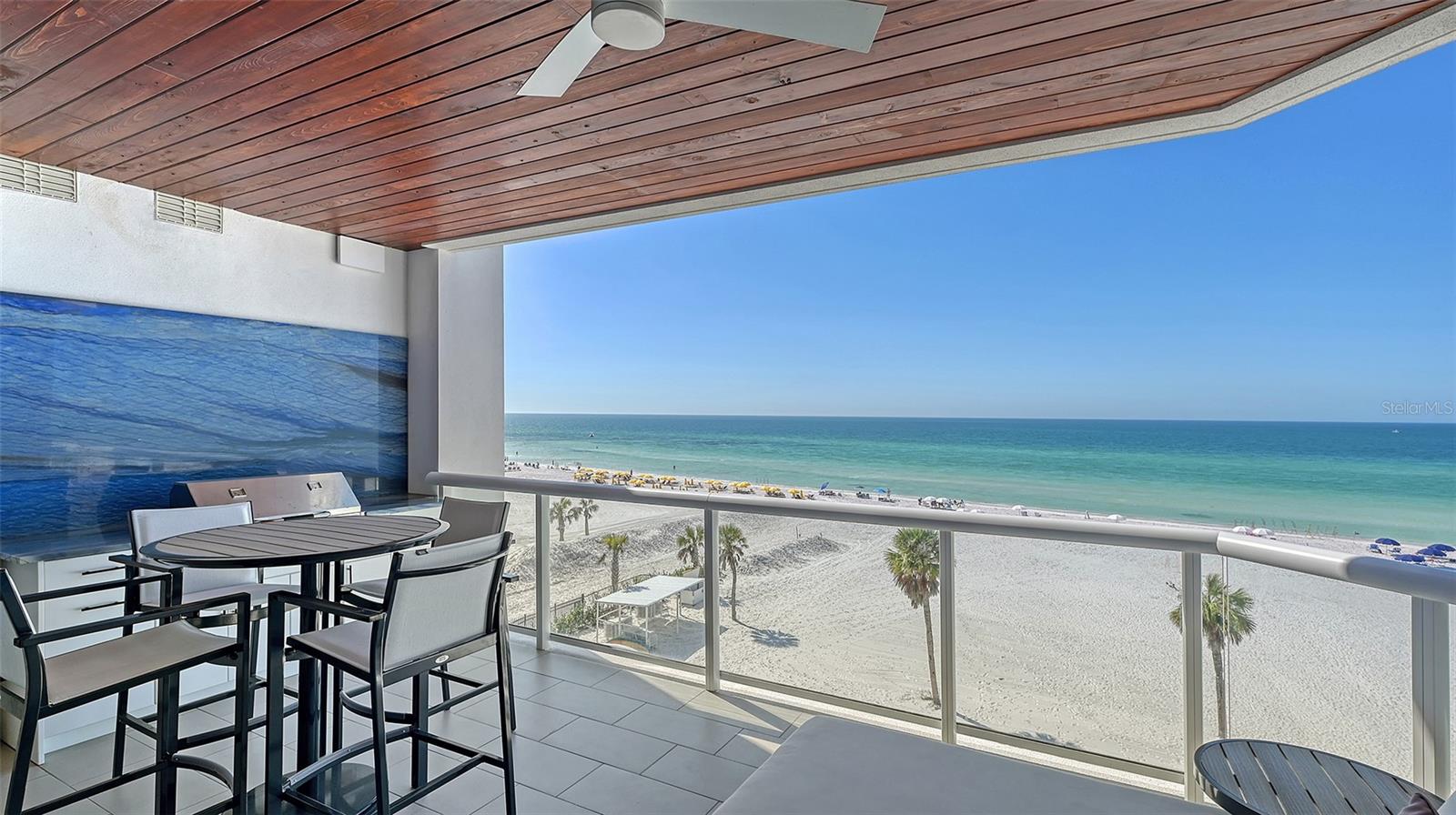 One-of-a-Kind Gulf-Front Luxury at Ten35 Seaside-
Welcome to Unit #503, an exquisite, custom-designed Gulf-front residence at Ten35 Seaside on South Siesta Key. This one-of-a-kind unit has been thoughtfully reimagined with over $400,000 in bespoke upgrades, elevating it to a level of luxury and exclusivity rarely seen on the market.
From the moment you arrive, convenience and prestige take center stage—this residence includes two deeded parking spaces and one of just eleven private storage lockers in the building. Inside, every detail has been meticulously curated, with a reconfigured layout that maximizes breathtaking, unobstructed Gulf views. The residence is adorned with exquisite precious stone slabs, state-of-the-art AV and automation, and acoustic paneling, ensuring an immersive living experience that seamlessly blends style and function.
The chef’s kitchen is a true showpiece, featuring a backlit precious stone backsplash, high-end appliances, and custom cabinetry designed for both beauty and practicality. Whether preparing meals for intimate gatherings or grand entertaining, this space is as functional as it is stunning. The adjacent wet bar further enhances the home’s entertaining appeal, boasting custom shelving, a full-size Sub-Zero wine fridge, and a beverage cooler—the perfect setting to host in style.
The primary suite is a private Gulf-front retreat, offering panoramic Siesta Key views, a spacious walk-in closet, and an elegant en-suite bath with dual vanities and a large walk-in shower. Three additional guest suites provide luxurious accommodations, each designed for comfort, convenience, and privacy. Extending the home’s grandeur beyond its interiors, the expansive outdoor living area features a custom outdoor kitchen, making it an idyllic space for dining al fresco while enjoying the sights and sounds of the Gulf.
Beyond the residence itself, Ten35 Seaside offers an unparalleled resort-style lifestyle with exclusive amenities, including beach attendants to set up chairs and umbrellas for effortless relaxation, a Gulf-front pool with breathtaking water view, on-site rental program providing income potential, on-site property management for a stress-free ownership experience, fire pits, grilling areas, and a state-of-the-art fitness center.
A rare offering in one of Siesta Key’s most coveted addresses, Unit #503 is the pinnacle of Gulf-front luxury. With its exceptional customization, unmatched design, and breathtaking location, this is more than a residence—it’s a coastal masterpiece. Welcome home!