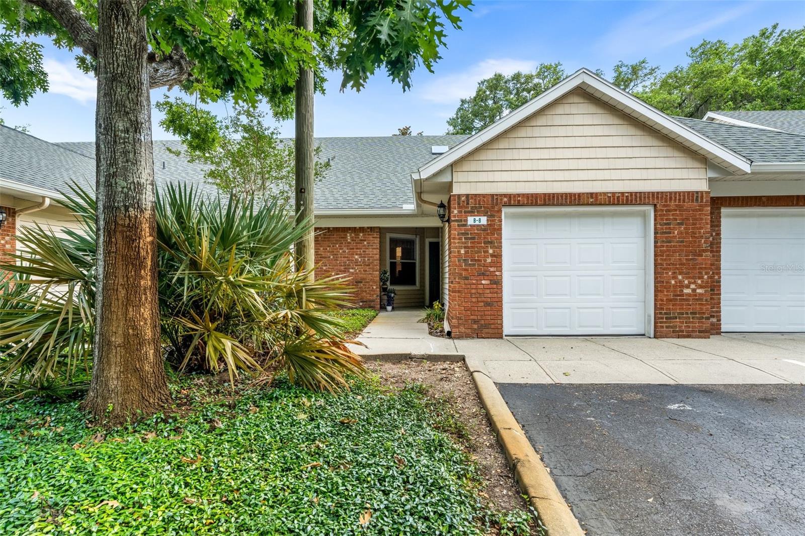 Experience stylish, low-maintenance living in this beautifully renovated SINGLE STORY 2-bedroom, 2-bathroom condo — THE OWNER JUST INSTALLED A BRAND NEW AC SYSTEM AND A BRAND NEW WATER HEATER — located in the highly sought-after Greens at West End, a secure, GATED COMMUNITY in the heart of Newberry, Florida. Just minutes from the University of Florida, North Florida Regional Medical Center, and Tioga Town Center, this prime location places you close to shopping, dining, and everyday essentials — Publix, Starbucks, and restaurants are less than a mile away. Inside, SOARING CATHEDRAL CEILINGS, SKYLIGHTS, and ideal north-south exposure fill the home with natural light, creating a bright and airy atmosphere all year round. LUXURY VINYL PLANK AND LAMINATE FLOORING run throughout, offering a modern look with easy upkeep. The UPDATED GOURMET KITCHEN is a chef’s dream, featuring STAINLESS STEEL APPLIANCES, GRANITE COUNTERTOPS, a breakfast bar, and an open-concept design that overlooks the spacious living area — perfect for entertaining. Both bathrooms have been stylishly refreshed with updated countertops, and each features GLASS-ENCLOSED WALK-IN SHOWERS — with the primary bath boasting a DOUBLE VANITY. Additional highlights include ELEGANT CROWN MOLDING THROUGHOUT, a BUILT-IN DESK AREA ideal for remote work or study, a LIGHT-FILLED PRIMARY SUITE WITH A GENEROUS WALK-IN CLOSET, a 2022 ROOF REPLACEMENT FOR ADDED PEACE OF MIND, and a SCREENED BACK PORCH WITH NO REAR NEIGHBORS — perfect for relaxing in privacy. Residents enjoy access to RESORT-STYLE AMENITIES, including a pool, hot tub, clubhouse, fitness center, tennis and pickleball courts, basketball court, playground, and dog run — all within the community. Whether you're a professional, a UF student, or simply looking to downsize without compromise, this move-in-ready gem delivers the perfect blend of COMFORT, CONVENIENCE, AND COMMUNITY. Don’t miss your opportunity to live in one of the BEST-LOCATED COMMUNITIES in the area!