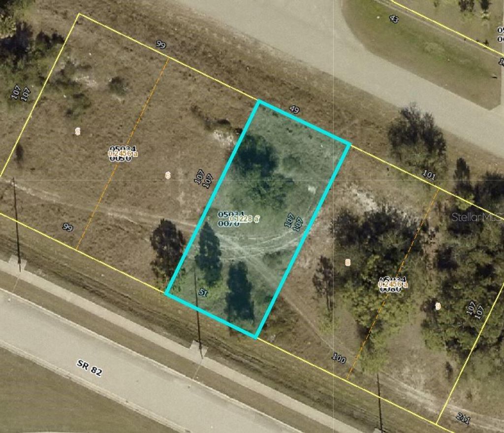 Photo of 1112 Meadow Road, Lehigh Acres, FL 33973 (MLS # C7525663)