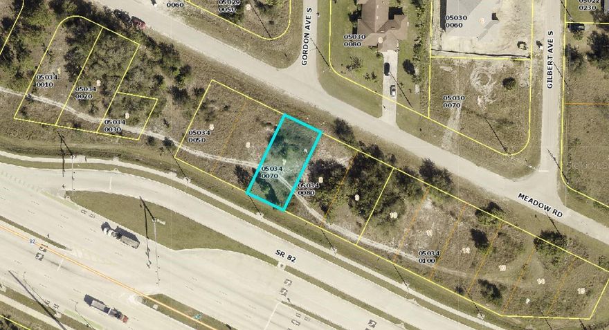 Commercial lot located just off State Road 82 in Lehigh Acres, Florida. Property fronts on Meadow Rd with excellent access and visibility. Property zoning allows most commercial uses and some industrial uses. Close to Fort Myers, I-75, Daniels Parkway and SW Florida International Airport.  Electric nearby provided by FPL.  Well and septic required.  PROPERTY LOCATED IN OPPORTUNITY ZONE #12071040122