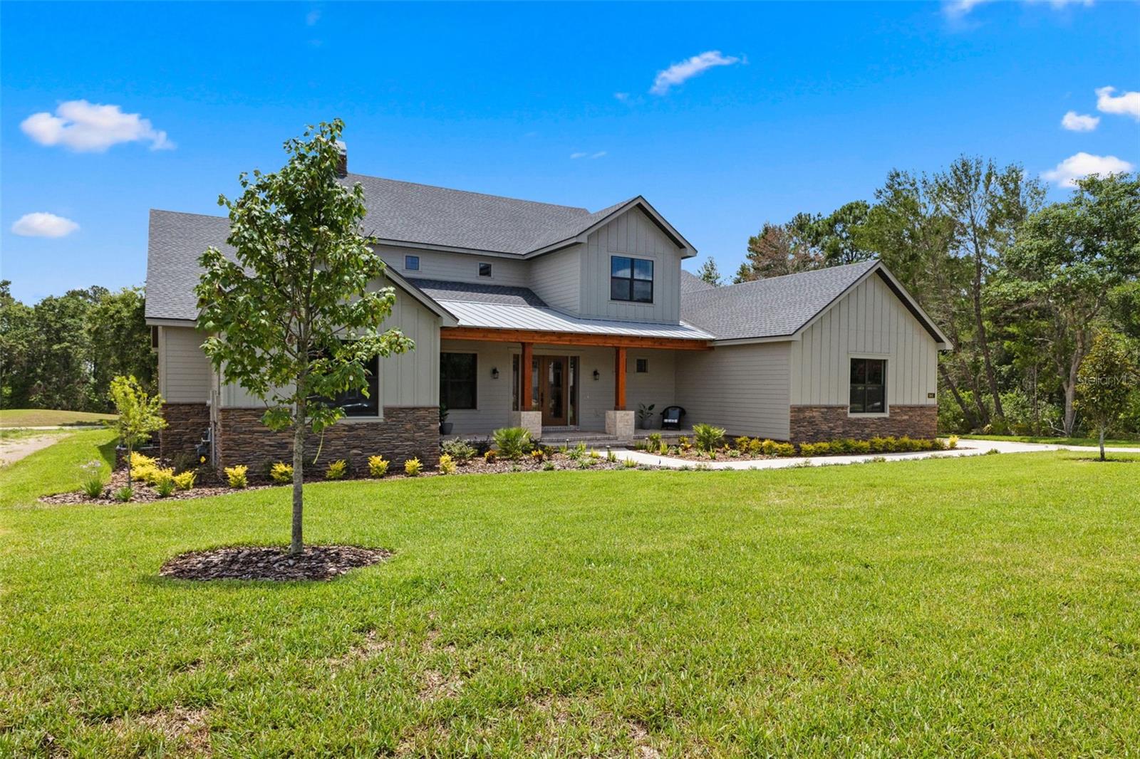 Under contract-accepting backup offers. One or more photo(s) has been virtually staged. Welcome Home to Refined Living in Southern Hills Plantation
Just completed and ready for its very first homeowner, 5865 Creek Ridge Rd is where timeless design meets modern comfort — all within the gates of the Southern Hills Plantation golf community.
This thoughtfully crafted estate offers over 5,700 square feet of beautifully designed living space on nearly half an acre, with peaceful views of the golf course as your daily backdrop. With 4 spacious bedrooms, 4.5 luxurious baths, and a 3-car garage with sleek epoxy floors, there’s room for everyone and everything you love.
You’ll find not just one, but two elegant primary suites on the main level — ideal for multi-generational living or welcoming long-term guests. High ceilings, rich engineered hardwood floors, custom built-ins, and an inviting fireplace create a warm, open gathering space that’s both stylish and livable.
Love to cook or entertain? The gourmet kitchen is a true showstopper, featuring dual center islands, a pot filler, under-cabinet lighting, and premium Bosch stainless appliances — perfect for everyday meals or holiday feasts.
Upstairs, an oversized bonus room with a wet bar and full bath offers endless possibilities: a home theater, game room, or private guest suite — you decide.
Step outside to the covered lanai and take in the serene setting. There’s plenty of space to build your dream pool or custom outdoor kitchen, already plumbed and ready for gas — the perfect extension of your Florida lifestyle.
This home is built with impact-rated windows and doors, offering peace of mind along with upscale comfort. And living in Southern Hills means you’re part of something truly special — a gated, resort-style community with a Pete Dye Signature golf course, clubhouse dining, spa, fitness center, tennis courts, and scenic walking trails shaded by majestic oaks.
If you’ve been dreaming of new construction in a one-of-a-kind setting, this is your chance. Come fall in love with 5865 Creek Ridge Rd — schedule your private tour today!
Just Completed and Ready For New Home Owner! Refined Luxury Living in Southern Hills Plantation Golf Community.