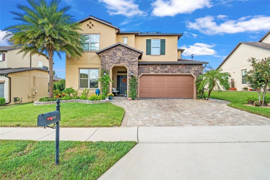Welcome to 1322 Woods Landing Drive, a stunning Central Florida residence offering modern design, luxurious finishes, and true resort-style living in the heart of Minneola. This home is thoughtfully designed for both comfort and entertaining, with every detail carefully curated for elevated living.

The open-concept layout is anchored by an oversized kitchen island—perfect for gatherings and entertaining—surrounded by premium cabinetry, elegant finishes, and high-grade tile flooring throughout the first floor. The spacious dining area easily accommodates large dinner parties or family celebrations.

A versatile downstairs bedroom includes a custom Murphy bed, providing a flexible space for guests, an office, or a multi-use suite; in addition to the other office in the front. Upstairs, the primary suite offers a spa-like retreat with a rainfall shower and a luxurious soaking tub.

Step outside to your private oasis featuring a large screened pool and spa, both heated for year-round enjoyment. The outdoor kitchen is fully equipped with a refrigerator, grill, burners, sink, and a rare tandoori oven—ideal for hosting unforgettable outdoor gatherings.

This energy-efficient home also includes full solar power, providing substantial utility savings and sustainable living.

Located just minutes from the Florida Turnpike, a brand-new hospital, shopping, and top-rated schools, this property offers both convenience and elegance.

Experience luxury, efficiency, and style—schedule your private showing today and discover why 1322 Woods Landing Drive is one of Minneola’s premier homes.
