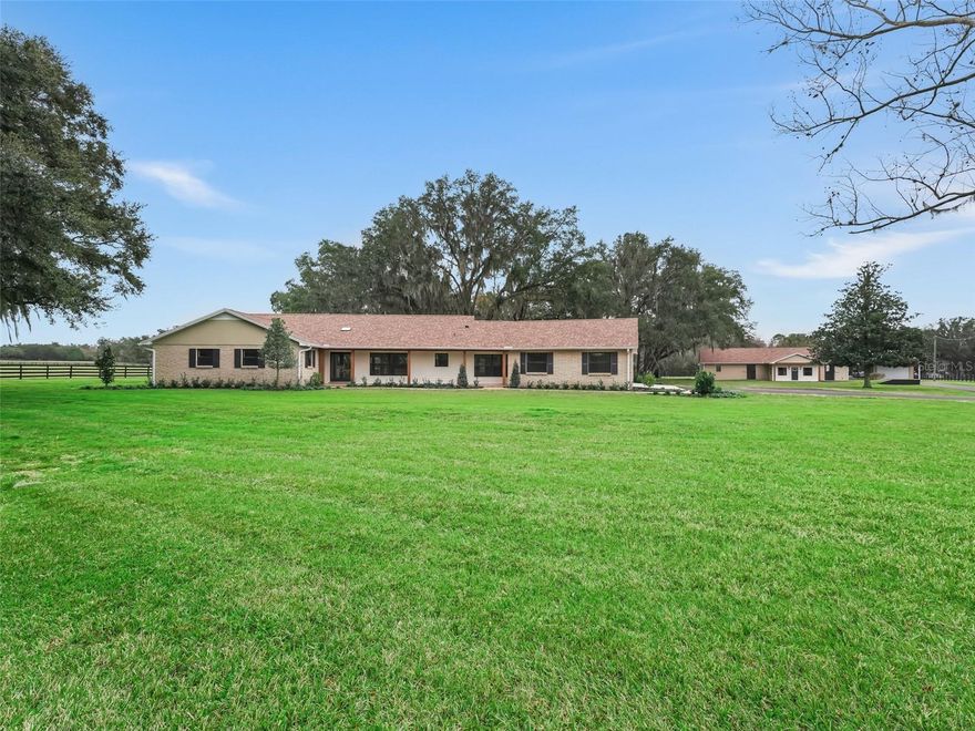 One or more photo(s) has been virtually staged. Picturesque 20 acre farm in the heart of the Horse Capital of the World. This better than new, 3 bedroom, 3 bath, ranch style home has been completely renovated from top to bottom with luxurious finishes, a bright open floor plan, and exquisite views of the farm dotted with grand live oaks. The home is complete with a beautiful chef’s kitchen with top of the line appliances, and a huge center island opening up to the living area making it perfect for entertaining. The home’s master bedroom is very spacious with a large walk in closet and spa-like en suite. You will also find ample guest rooms, a separate office and a large second living area that opens to the back porch overlooking the spring fed pond. Just a few steps away, you will find the 6 stall, center aisle block barn with an indoor wash rack, large tack room, full bath, and even has it’s own wine cellar! The second barn is also conveniently located close to the outdoor was rack and round pen. This barn has 6 more stalls, with a huge storage garage attached. The farm currently has 6 large, lush paddocks with freshly painted fencing and several nice areas to choose from to ride or add an arena. Don’t miss this beautiful farm located on a quiet cul de sac, but just 7 miles from WEC and 8 miles to HITS! *** additional acreage next to farm also available