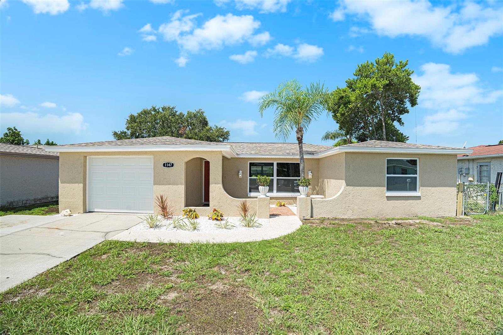 Completely and Professionally remodeled Home with POOL!!! This is a beautifully
designed modern/traditional Two-bedroom, two full bath,1 car garage with a screened
inground pool. The pool has a New acrylic coating, new pump and filter casing. This
home boasts Style and Design with many amenities and extras. The New kitchen has
granite counters, stainless-steel sink with gooseneck faucet, stainless-steel appliances
designer range hood and butcher block peninsula with breakfast bar. The high-end
finishes flow throughout the house and into the beautifully updated bathrooms with
custom tile, glass mosaic tile inserts and a modern rain shower with body jets and water
wand. One bath is oversized with double sinks, custom granite counters and a built-in
make-up vanity. Home has great closets and storage throughout. New upgraded doors,
hardware along with New beautiful luxury waterproof plank flooring throughout the
house. The professional remodeling of this house was not just a face lift. The house has
all New updated switches, outlets, light fixtures, updated plumbing and Brand-New
Roof, New Lennox HVAC. Even the garage has been updated with fresh paint and a
freshly coated epoxy floor with broadcast accent flakes. This house does not disappoint
on curb appeal either. The total remodel includes a new paver patio, freshly painted
house with a newly seeded and landscaped front and back yard along with a new plant
bed in front. This home is close to Tarpon Springs Sponge docks, restaurants,
shopping, multiple beaches and public parks. This is a gorgeous house that checks off
all the wish list items. It is move in ready and WILL NOT LAST!!