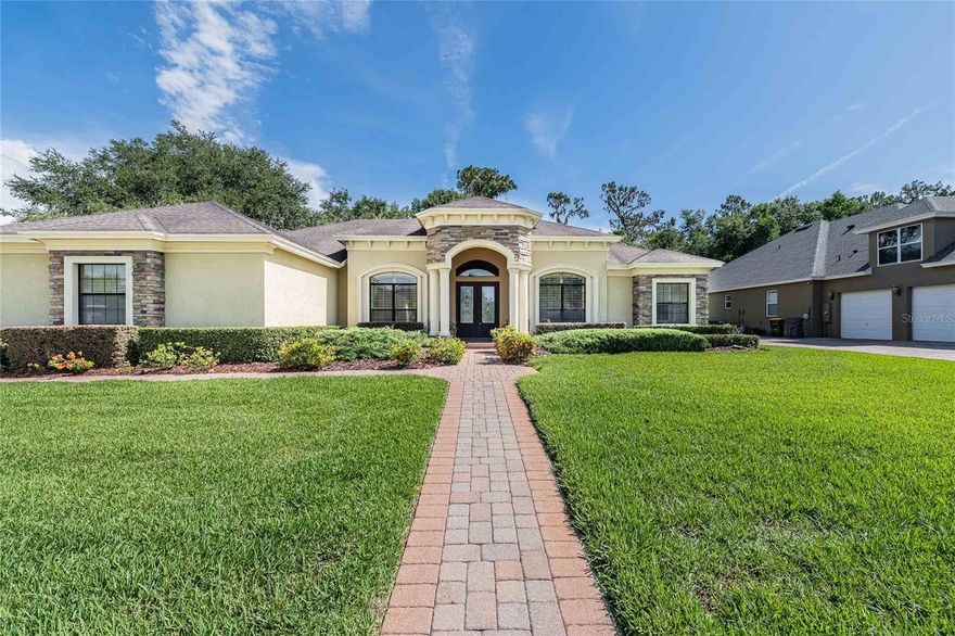 5 bedroom, 3 bath pool home in the highly desirable gated Crescent Woods community. This upscale home features a large open floor plan with crown molding and high end finishes. As you enter the home you will notice the high ceilings with handcrafted tray designs and beautiful hardwood flooring throughout the living areas. The formal living space is just right for relaxing with cocktails, before you move into the exquisite formal dining room with chandelier and tray ceiling. The bright  open kitchen overlooking the family room and breakfast nook is a chef's dream. Featuring granite countertops, custom island with extra storage, high end stainless steel appliances, gas range with a high flow range hood, a wall of pantry doors hiding a large hidden pantry, and a raised breakfast bar for entertaining guests or little helpers looking to sneak a bite of home cooking. The breakfast nook features a large window overlooking the pool and patio space. The family room is perfectly located just off the kitchen with a gas fireplace, hearth mounted TV and custom cabinetry. The space around the fireplace screams cozy Christmas morning with the perfect corner for the Christmas tree. 
Across the house you will find a grand primary suite. Primary bedroom features additional space for a sitting area, private doors to the pool deck, a large (4x10) closet with custom california closet shelving and double tray ceiling with lights. The primary bathroom is a relaxing oasis with a second walk-in closet (7x7) with custom California closet shelving, dual vanities, a built-in makeup vanity, jetted tub with space for 2, walk-in shower with rainfall shower head and a TV viewable from the tub. Just beyond the family room is the 4th bedroom with a private bath sharing pool access. This bedroom is perfect for a guest or inlaw suite away from the rest of the house. Bedrooms 2 and 3 share a jack and jill style bathroom with dual sinks, granite countertops, and private shower/toilet room. Just off the primary bedroom you will find the 5th bedroom/home office space with a built-in desk for two and an executive style bookshelf.  
At the back of the home you will find the pool designed and built by Griffin Pools. The large paver deck around the pool with the outdoor kitchen is perfect for entertaining or family cookouts. Keep the pool party going year round with both a solar and gas heater that can be operated by remote. Property comes partially furnished. This home is a must see what all the custom upgrades and located just minutes from shopping, medical and dining.