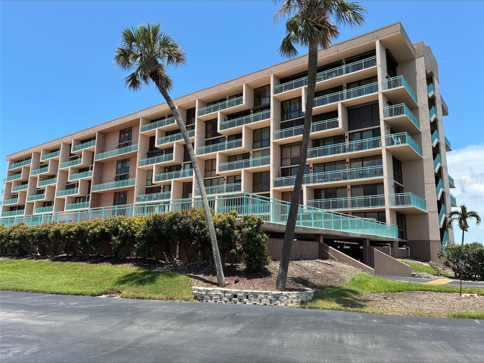 This condo community is on its' own private waterfront island overlooking John's Pass in Treasure Island. Just a short distance to a stunning sand beach, boardwalk and sunset watching over the Gulf. You won’t want to miss this spacious waterfront condo at Key Capri which offers comfort & convenience inside and out. Community boasts heated pool & spa, exercise room, grill areas, shuffleboard, PRIVATE GATED access with 24 hour security. Nice open living and dining space makes entertaining a breeze and easy flow out to your 25’ private balcony with South facing views and even a peek-a-boo view of the Gulf, sunset skies galore! Inside continues to feature an open modern kitchen with wood cabinets all with soft close, stone backsplash and granite countertops complete will all stainless steel appliances. The split bedroom layout offers plenty of privacy between the 2 bedrooms and 2 baths. The primary suit wows with a spacious layout, floor to ceiling windows, custom barn door entry to the spa bath and slider to access your private balcony. No spa bathroom would be complete without the beautiful tile walk-in shower, stone counter w/ dual vanity and make-up area, and tons of storage with a walk-in closet, linen and another storage closet. Guest bedroom is also spacious, has a generous size closet and close access to the second beautiful spa-style bathroom. The spacious guest bathroom will not disappoint your guests and they’re sure to enjoy the large walk-in tile shower and stone countertop. Laundry in unit with a standard size stackable washer and dryer. Outside the unit continues with covered RESERVED PARKING for one vehicle, Plenty of guest parking on site as well and waterfront community amenities galore. This waterfront community is beach life at it’s best. Fishing dock, and tons of other amenities including gated access, tennis courts, heated pool and jacuzzi, sauna and fitness center, fishing pier, social areas inside and out on features outdoor Tiki Hut, community library