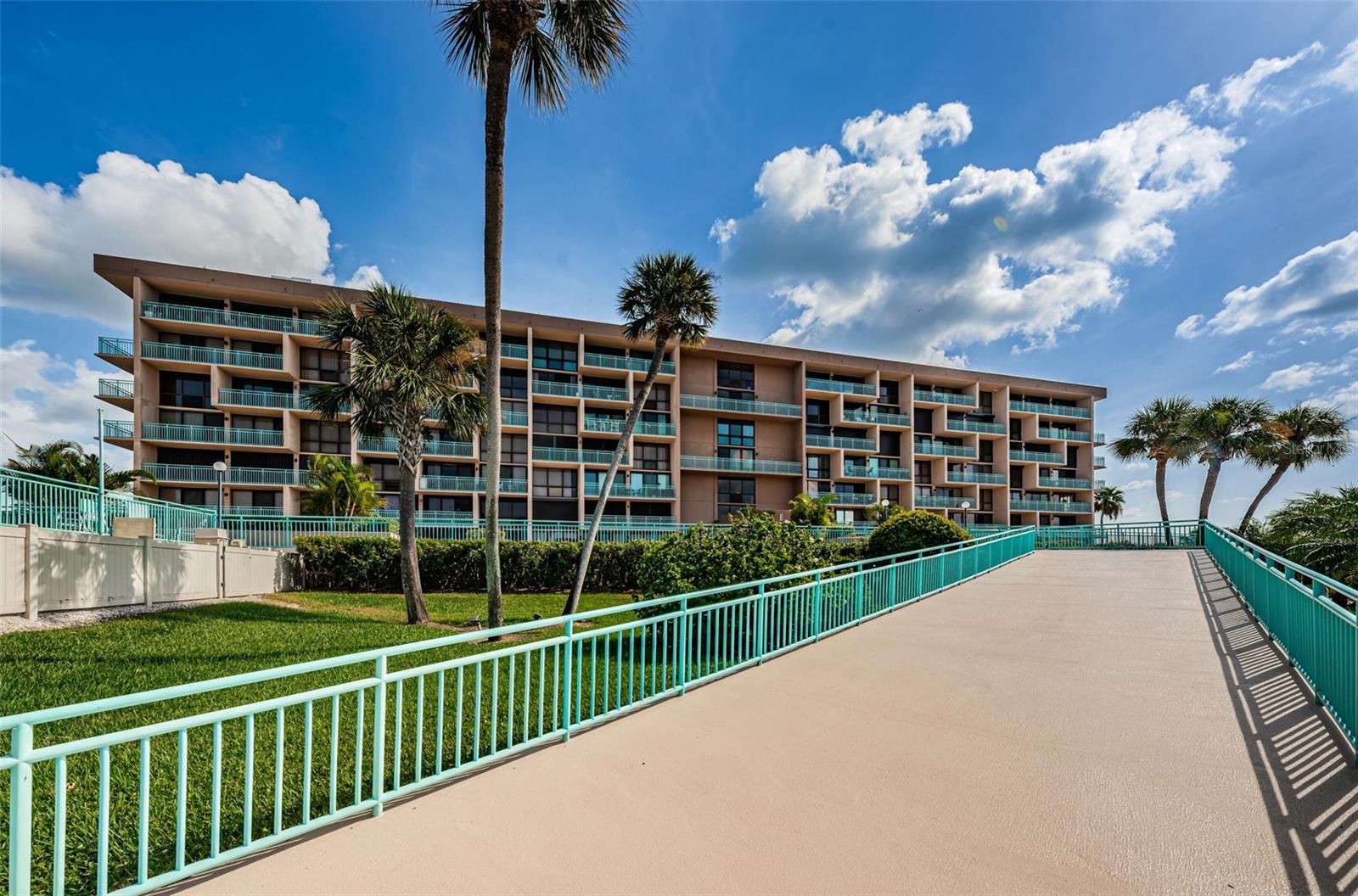 Location is stunning with is on its' own private waterfront island overlooking John's Pass in Treasure Island. Just a short distance to a stunning sand beach, boardwalk and sunset watching over the Gulf. You won’t want to miss this spacious waterfront condo at Key Capri which offers comfort & convenience inside and out. Community boasts heated pool & spa, exercise room, grill areas, shuffleboard, PRIVATE GATED access with 24 hour security. Nice open living and dining space makes entertaining a breeze and easy flow out to your 25’ private balcony with South facing views and even a peek-a-boo view of the Gulf, sunset skies galore! Inside continues to feature an open modern kitchen with wood cabinets all with soft close, stone backsplash and granite countertops complete will all stainless steel appliances. The split bedroom layout offers plenty of privacy between the 2 bedrooms and 2 baths. The primary suit wows with a spacious layout, floor to ceiling windows, custom barn door entry to the spa bath and slider to access your private balcony. No spa bathroom would be complete without the beautiful tile walk-in shower, stone counter w/ dual vanity and make-up area, and tons of storage with a walk-in closet, linen and another storage closet. Guest bedroom is also spacious, has a generous size closet and close access to the second beautiful spa-style bathroom. The spacious guest bathroom will not disappoint your guests and they’re sure to enjoy the large walk-in tile shower and stone countertop. Laundry in unit with a standard size stackable washer and dryer. Outside the unit continues with covered RESERVED PARKING for one vehicle, Plenty of guest parking on site as well and waterfront community amenities galore. This waterfront community is beach life at it’s best. Fishing dock, and tons of other amenities including gated access, tennis courts, heated pool and jacuzzi, sauna and fitness center, fishing pier, social areas inside and out on features outdoor Tiki Hut, community library