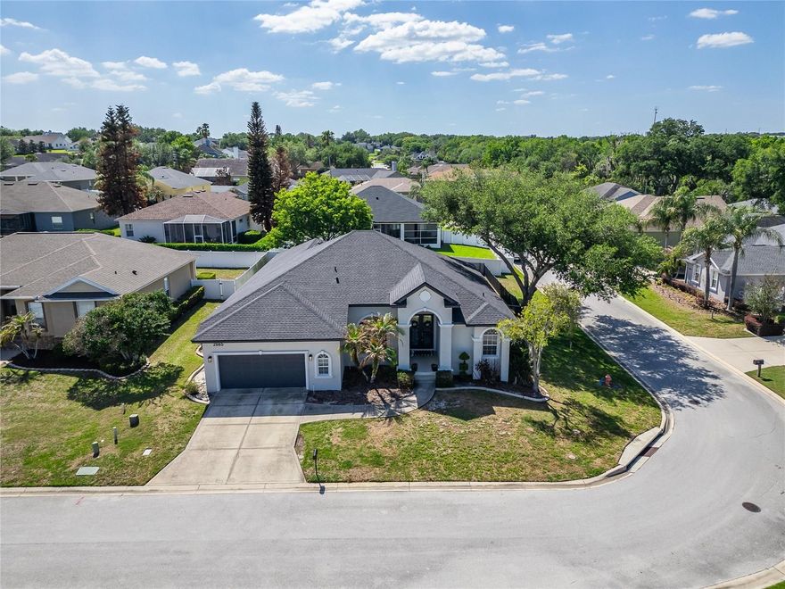 Welcome to this beautifully maintained and nicely updated with lux finishes custom built home in the highly sought-after gated community of Crews Lake Trails in South Lakeland, located within the desirable George Jenkins school district. Built by award-winning Tapia Construction, this spacious residence features 4 oversized bedrooms, 2 full bathrooms, and a thoughtfully designed layout perfect for both everyday living and entertaining.

Inside, you’ll find formal living and dining rooms, an expansive family room open to the kitchen, and a charming breakfast nook for casual dining. The home also includes a dedicated flex space ideal for a butler pantry, home office or computer room. Three of the bedrooms include walk-in closets, providing ample storage throughout.

This home is filled with upgrades, including crown molding, marble countertops, stainless steel appliances, beautiful wood flooring, new ceramic tile, new lighting and French doors that bring in natural light and elegance. The oversized two-car garage includes built-in shelving and attic access with a pull-down ladder for additional storage.

Situated on a corner lot, the exterior is just as impressive with mature landscaping, a recently updated irrigation system, and a fully fenced backyard with a double picket fence—perfect for pets. Relax and unwind on the screened-in lanai while enjoying peaceful sunset views. This home has been meticulously maintained and is move-in ready.

Schedule your private showing today and experience everything this exceptional property has to give!