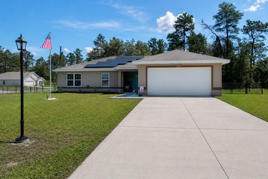 Experience the benefits of newer construction—without the wait, added furnishing costs, or
uncertainty—combined with the energy efficiency of the seller-owned 11.725 kW rooftop solar system
installed in 2023 and under full warranty, an approx. $45,000 value. This beautifully maintained 2020-built
4 Bdrm/2 Bath concrete block home offers 1,752 Sq Ft of comfortable living space and the rare advantage
of dramatically reduced electric bills while OWNING your own power source. Designed with modern living
in mind, the open floor plan creates a seamless flow between the living, dining, and kitchen areas, making
the home ideal for both everyday living and entertaining. Tile flooring extends throughout the main living
areas, while BRAND NEW carpet adds comfort to all four bedrooms. The spacious kitchen features solid
wood cabinetry, abundant counter space, and a convenient breakfast bar overlooking the main living area.
A desirable split-bedroom layout provides privacy for the owner's suite, while the interior laundry room
adds everyday convenience. Step outside and enjoy Florida living year-round from the expansive 16 x 24
covered screened porch, perfect for relaxing, outdoor dining, or gathering with family and friends.
Situated on an oversized 0.34-acre corner lot, the property offers exceptional outdoor space, including a
fully fenced backyard with plenty of room for pets, play, gardening, or future enhancements. Located in
Marion Oaks, a deed-restricted community conveniently positioned near major highways, schools,
shopping, dining, medical facilities, and the Marion Oaks Community Center, this home offers the perfect
balance of peaceful neighborhood living and easy access to everyday amenities. Whether you're searching
for a primary residence, retirement home, or simply looking to enjoy the long-term savings and benefits of
solar ownership, this move-in-ready property delivers outstanding value. Don't miss this opportunity to
own a newer home on a large lot with no HOA restrictions. Schedule your showing today and discover just
how affordable Florida solar living can be!