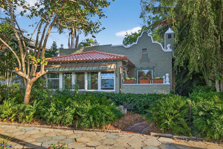 OPPORTUNITY KNOCKS! Rare chance to own a Spanish Mediterranean gem in the heart of Historic Old Northeast. Located on a beautiful brick-lined street at 745 16th Ave NE, this architecturally rich residence offers timeless character, incredible bones, and endless potential for the buyer with vision. This 3 bedroom + den, 2 bathroom home with detached 2-car garage and oversized carport showcases many original details that make Mediterranean homes so special, including authentic Cuban tile flooring, original hardwood floors, crystal door hardware, elegant crown molding, tile window sills, and graceful architectural arches. Large impact-rated windows and doors fill the home with natural light, highlighting the charm and craftsmanship throughout. The kitchen features custom cabinetry with pull-out storage, cabinetry-panel dishwasher, JennAir French door refrigerator, gas range, and Sharp microwave drawer. The spacious layout includes an oversized bedroom with built-in bench nook and storage, custom closet systems, and built-ins in the third bedroom/office. Major updates completed around 2009 include electrical and plumbing improvements, PVC water and sewer lines, 200 amp Cutler Hammer electrical panel, Eaton garage sub-panel, Lutron lighting, recessed LED lighting, Honeywell smart thermostats, IQ security system, Takagi gas tankless water heater, and water softener. Outdoor spaces include a private side courtyard, brand new landscaping with drip irrigation, and the rare opportunity to access the rooftops of both the main house and detached garage—an incredible feature with exciting potential. The detached garage also features a Daikin mini-split system and washer/dryer hookups, adding flexibility for storage, workspace, or future use. Just moments from Coffee Pot Bayou, waterfront parks, vibrant downtown St. Petersburg, and everything that makes Historic Old Northeast one of the city’s most coveted neighborhoods, this is a rare opportunity to create something truly special in an iconic St. Petersburg location.