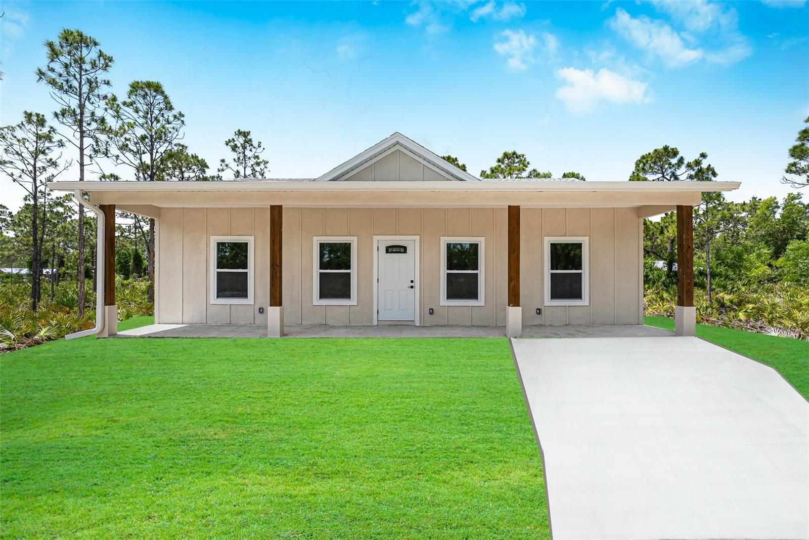 One or more photo(s) has been virtually staged. This exquisite residence, nestled in the serene Country-like and peaceful neighborhood of Punta Gorda and safely outside any flood zones, epitomizes contemporary elegance and practicality. Currently under construction, it boasts an open-plan layout accentuated by lofty ceilings and chic tile flooring, creating an atmosphere of expansive warmth. The kitchen seamlessly blends functionality with fashion, featuring the latest in soft-close cabinetry, ample storage space, brand new microwave, stove, dishwasher, and refrigerator . Not to mention a breakfast bar ideal for social gatherings, all while showcasing top-notch materials for an effortlessly modern and low-maintenance lifestyle. Enhanced with hurricane-resistant windows, the home promises durability and safety, ensuring peace of mind. Accommodation includes generously sized double-suite bedrooms, each large bathrooms. Notably, one bedroom is designed with guest access to afford both privacy and comfort. The expansive backyard presents a blank canvas to craft a secluded oasis for entertainment and potential pool installation. Its prime location approximately 3 miles from I-75 facilitates smooth commutes, while proximity to Punta Gorda and Fort Myers airports adds to its appeal. Daily conveniences are within easy reach, with Publix and Walmart merely 4 miles away. For leisure, Cecil’s Web offers a multitude of outdoor activities such as four-wheel riding, hunting, trail walking, fishing, biking, and wildlife observation. This home is a harmonious blend of style, functionality, and security, designed to fulfill diverse needs. Seize the opportunity to embrace the Southwest Florida lifestyle in this luxurious, modern, and conveniently located Punta Gorda abode.