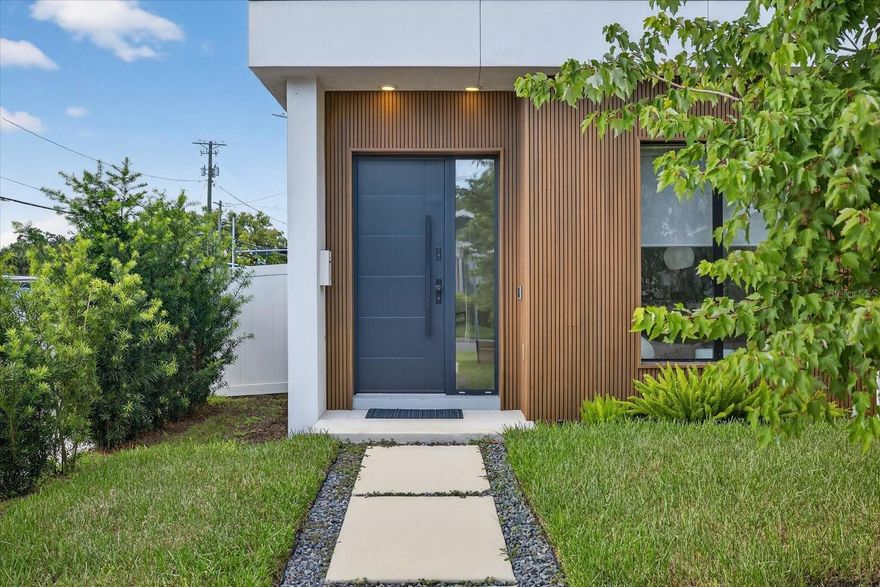 Located just steps from Armature Works and downtown Tampa, this modern 3 story townhome offers sleek design paired with functional living. Featuring 3 bedrooms, 3.5 bathrooms, and a flexible first floor bonus room, the layout provides comfortable space for both everyday living and entertaining.

The open concept second floor showcases a chef’s kitchen with custom cabinetry, quartz waterfall countertops, a wine fridge, and an imported Italian ILVE gas range. A panel front refrigerator blends seamlessly into the design, while 10 foot ceilings and hardwood flooring create a bright, spacious feel throughout the living and dining areas.

The top floor features a private rooftop terrace, ideal for relaxing or enjoying city views. Additional highlights include a 2 car garage with an electric vehicle charging station, hurricane impact windows, and French doors leading to a private backyard space.

All within minutes of Tampa’s best dining, waterfront, and entertainment, offering a low maintenance lifestyle in one of the city’s most desirable locations.