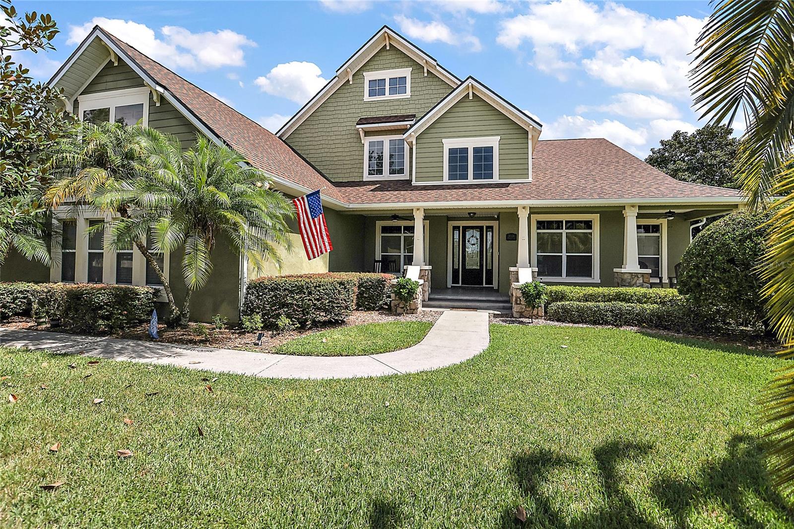 Be prepared to say WOW to this home! You will immediately fall in love with this gorgeous 5 bedroom 4 bath home. The stunning curb appeal will catch your eye the moment you drive into the driveway. As you enter through the front door, you will notice the high ceilings and open floor plan. Chef's dream kitchen with tons of cabinet and counter space, high end appliances, breakfast area plus a full built in butlers/bar area. Large living area with beautiful accent wall has french doors that lead to pool area. Enjoy entertaining in your formal dining room with built in's and fire feature. Double door entry leads to den/office. Romantic oversized master suite with lounging area plus walk in closet, his and her sinks, garden bath and glass shower. Split bedroom plan with bedrooms two and three. Bathroom 2 features a glass shower and door that leads to pool area. Bedroom 4 currently used as an office with built in desk also has a bathroom with a glass shower. Head on upstairs to find the HUGE game room with built in bar that has Lake Joanna views. Bedroom 5 is located upstairs with a large walk in closet. Bathroom 4 has a tub/shower combo. Enjoy relaxing in the evenings in your gorgeous screened in pool. Fully fenced backyard. make sure you bring your boat and fishing poles! The community boat ramp is right across the street. The location of this home is hard to beat with just minutes to shopping, restaurants, hospital and more! You will not be disappointed the moment you see this home! Call today!