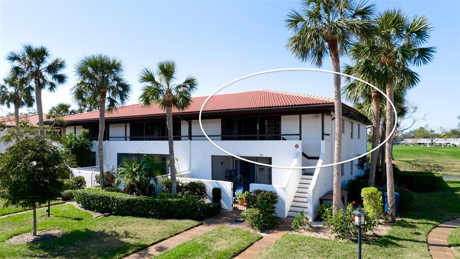 One or more photo(s) has been virtually staged. IMG GOLF COURSE CONDO WITH LAKE & FAIRWAY VIEWS! The CORNER LOCATION offers additional windows for an expanded view and more natural light. The benefits of living upstairs are a better view, quieter, more privacy, greater security, and a lovely breeze when sitting out on the lanai for that morning or evening beverage. Popular light gray color carried through the quartz kitchen counter, subway backsplash, and painted walls. There is an attractive mix of mahogany plank flooring with contrasting contemporary cabinets. In the kitchen, STAINLESS STEEL APPLIANCES AND RECESSED CEILING LIGHTS. The floor plan creates TWO MASTER SUITES, each with private direct access to the bathroom. The bathrooms are updated with pedestal sinks and Travertine marble flooring. The neighborhood pool & hydrotherapy spa help relax the body after a fun day enjoying the EL CONQUISTADOR RECREATIONAL LIFESTYLE. The IMG Country Club is semi-private. It has a restaurant with a scenic view over Sarasota Bay. The United Tennis Academy offers an active tennis program at reasonable rates. There are miles of sidewalks for walking and a bicycling lane along the El Conquistador Parkway Extension - which is a shortcut to the Gulf beaches and great seafood restaurants in the historic Village of Cortez. READY FOR IMMEDIATE OCCUPANCY! No CDD fees.