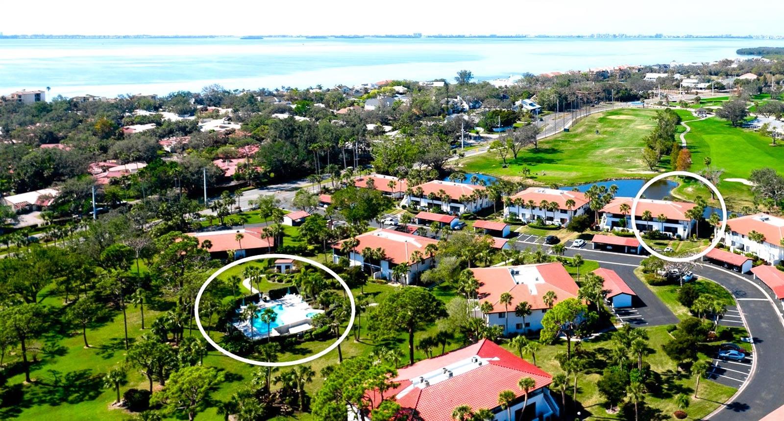One or more photo(s) has been virtually staged. IMG GOLF COURSE CONDO WITH LAKE & FAIRWAY VIEWS! The CORNER LOCATION offers additional windows for an expanded view and more natural light. The benefits of living upstairs are a better view, quieter, more privacy, greater security, and a lovely breeze when sitting out on the lanai for that morning or evening beverage. Popular light gray color carried through the quartz kitchen counter, subway backsplash, and painted walls. There is an attractive mix of mahogany plank flooring with contrasting contemporary cabinets. In the kitchen, STAINLESS STEEL APPLIANCES AND RECESSED CEILING LIGHTS. The floor plan creates TWO MASTER SUITES, each with private direct access to the bathroom. The bathrooms are updated with pedestal sinks and Travertine marble flooring. The neighborhood pool & hydrotherapy spa help relax the body after a fun day enjoying the EL CONQUISTADOR RECREATIONAL LIFESTYLE. The IMG Country Club is semi-private. It has a restaurant with a scenic view over Sarasota Bay. The United Tennis Academy offers an active tennis program at reasonable rates. There are miles of sidewalks for walking and a bicycling lane along the El Conquistador Parkway Extension - which is a shortcut to the Gulf beaches and great seafood restaurants in the historic Village of Cortez. READY FOR IMMEDIATE OCCUPANCY! No CDD fees.