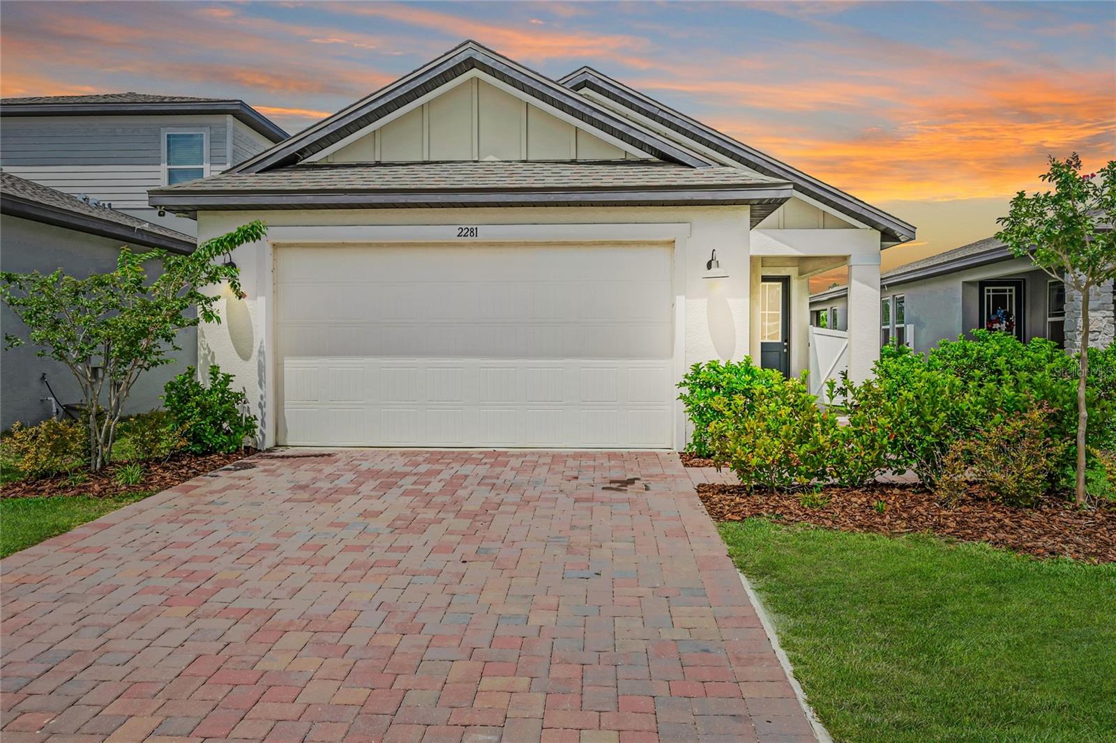 Welcome home to sunny, easy living in the heart of the Hills of Minneola, one of Central Florida’s most exciting and fast-growing communities! This light and bright 3-bedroom, 2-bathroom home, 2-car garage is full of modern upgrades, stylish details, and energy-efficient touches that make everyday life feel like a breeze. From the moment you pull up, the brick paver driveway and covered front porch create a warm, welcoming vibe. Step inside and you’ll be greeted by a fresh, open-concept floor plan that flows beautifully from room to room. The kitchen is a showstopper, featuring granite countertops, 42” white cabinetry, stainless steel appliances, kitchen island that seats four, and seamless connection to the dining and living areas. Whether you’re enjoying a quiet dinner or entertaining guests, this layout is designed to make it easy. The interior laundry room—complete with washer and dryer—adds everyday convenience, and the epoxy-coated garage floors with overhead storage take this home's functionality to the next level. The split-bedroom layout offers extra privacy, with a spacious primary suite that includes dual vanities with granite countertops, huge walk-in shower with glass shower door, and a large walk-in closet. The additional bedrooms are filled with natural light and plenty of space to relax or work. Step outside to a covered patio, perfect for grilling, relaxing, or taking in the fresh air and stunning panoramic views. This home sits near one of the highest elevations in Florida—so every sunset feels extra special. But that’s just the beginning. The Hills of Minneola community offers incredible amenities including two playgrounds, two dog parks, and a resort-style pool, beach entry pool, clubhouse, fitness center, tennis and pickleball courts, and walking trails all coming soon. With a new K–8 school and Advent Health hospital opening in the near future, everything you need is right around the corner. You’re also just minutes from the Florida Turnpike, with easy access to Downtown Orlando, Disney, SeaWorld, Winter Garden, and Clermont’s Waterfront Park. Shopping, dining, and fun are always just a short drive away. This home offers the perfect blend of style, location, and value. Don’t miss your chance to own a slice of this vibrant, growing community—schedule your private tour today! Need 100% financing this home qualifies for USDA home loan. Also ask about 5% down payment assistance for FHA loans through our preferred lender.