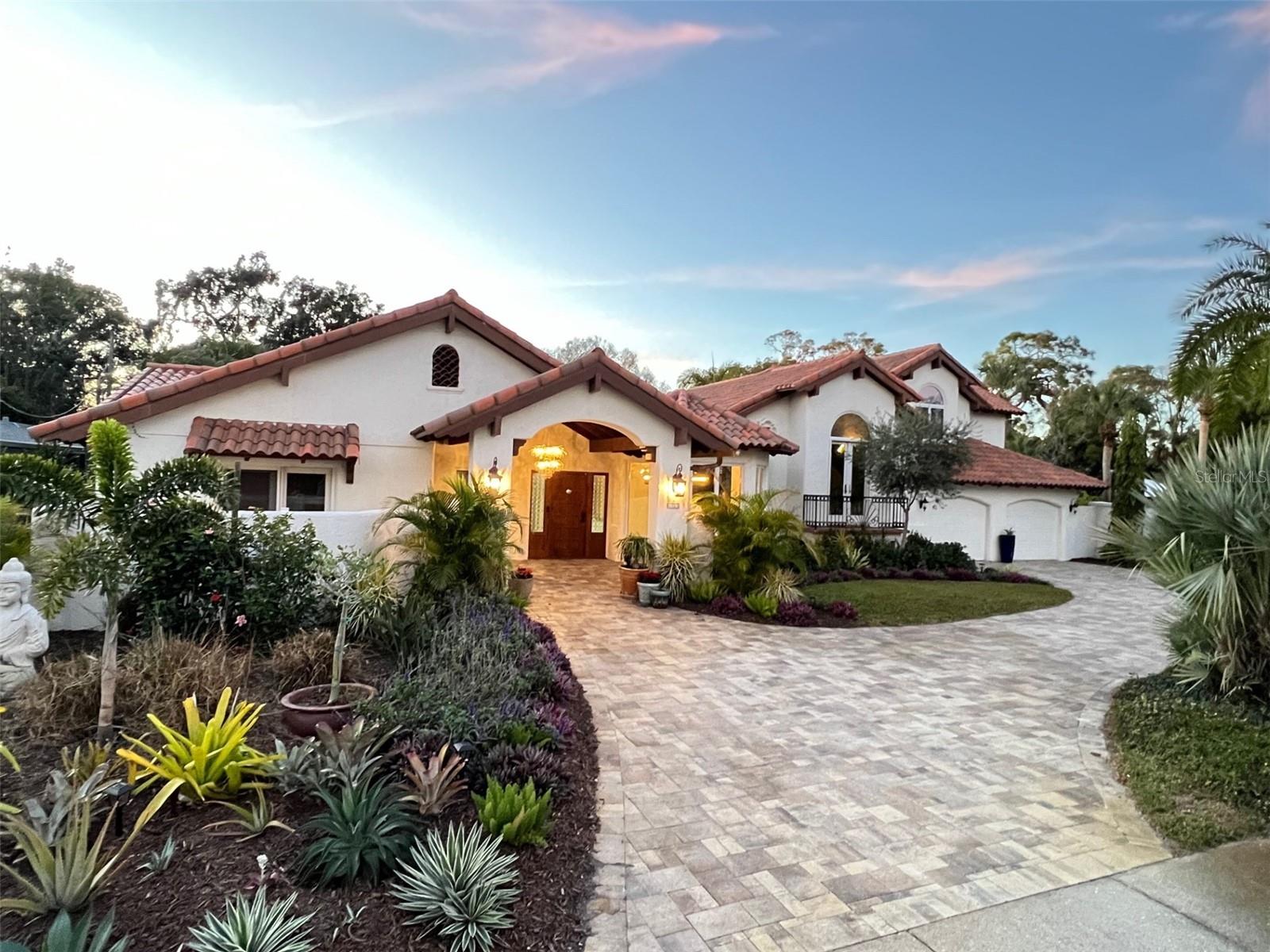 Casa Concha Grande: Enter this private paradise in the highly desired Sapphire Shores neighborhood. This is one of the most iconic and well-known homes on Bay Shore Rd., just 5 houses south from the Ringling Museum and Asolo Theater. Location, character and charm define this unique residence. Gracious entertaining spaces. High vaulted 18' beamed ceilings. Large Master Bedroom boasts top of the line master bath with designer fixtures, oversized bathtub overlooking gardens and a custom designed walk in closet. Great Room/Family room is open to the kitchen with unique granite countertops, breakfast counter and wine bar. Large second bedroom has French Doors that open to the private front patio. Huge screened Lanai with Spanish tiled fountain overlooks the large pool and patio area with an outdoor half bath and separate rain shower. Secluded Hot tub area also has an outdoor rain shower, as well as a fire pit for relaxing in the evenings. The backyard is surrounded by mature landscaping and a 6' privacy wall. Upgrade and improvements list is in attachments. Shed with de-humidifier, electricity and A/C. Two car garage with EV high capacity 220V charger and full size refrigerator. The home has a separate apartment above the 2 car garage with it's own separate entrance, private yard area and access to the backyard. Separate apartment has Mexican-styled bathroom and full kitchen, and is ready for use as part of the home, or as a separate rental or in-law suite. We are listing the upstairs apartment/in-law suite as the 4th bedroom. This exquisite entertaining home is one block away from Sarasota Bay. Sapphire Shores is a great walking neighborhood close to Sun Circle Park and Sarasota Bay, Ringling Museum, Asolo Theater, and New College. One mile to the Sarasota Bradenton International Airport. Seller is willing to pay for title, depending on amount of offer; HUGE savings!
