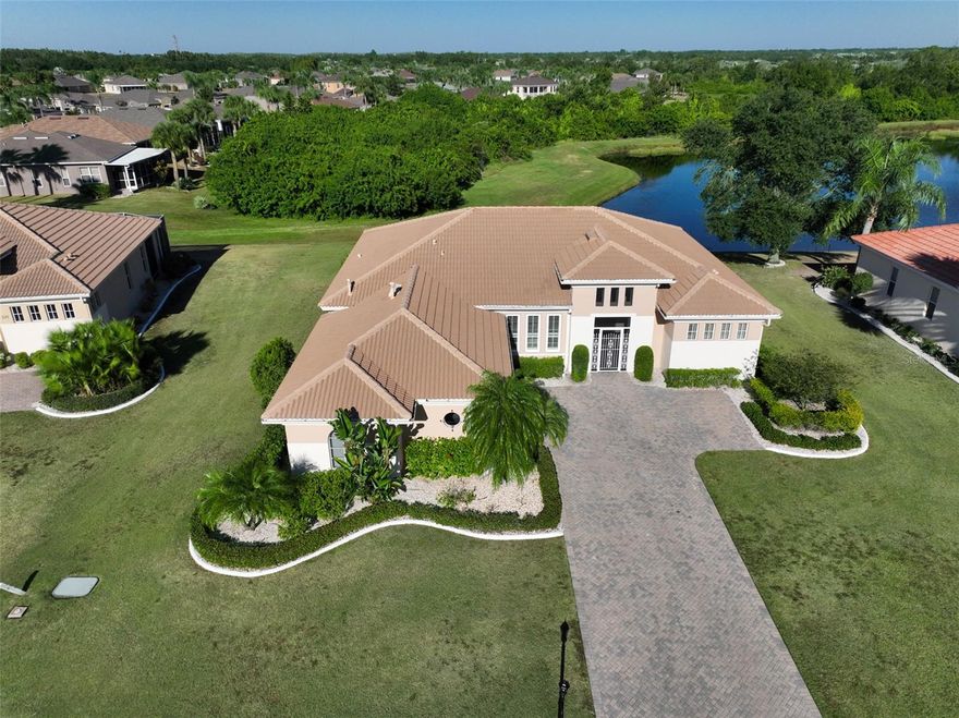 Click on 3D tour above ------ EXCEPTIONAL EXECUTIVE HOME WITH PRETTY WATER VIEWS!  Welcome to this IMMACULATE AND PERFECTLY MAINTAINED, 3 BEDROOM/2 BATH home, in the premier 55+ community of Renaissance in Sun City Center, FL.  This lovely "BIARRITZ" model is situated on a large PREMIUM WATER VIEW LOT that boasts great views all across the rear of the home and is nestled in a highly desirable area.  The stunning curb appeal is enhanced with NEWER EXTERIOR PAINT 2025, brick paver driveway, lush landscaping, TILE ROOF (INSPECTED EVERY 6 MONTHS) and side facing attached OVERSIZED GARAGE.  Step through the inviting screened entryway and fall in love with the neutral decor, ceramic tile floors in main living areas, crown molding, plantation shutters & custom window treatments plus DOUBLE PANE WINDOWS THROUGHOUT (2011).  The open concept living room & dining room is the perfect space for entertaining and allows for easy flow out to the lanai area.  The eat-in kitchen is a cook's delight with beautiful wood cabinetry w/pullouts, stainless appliances, granite counters, large bay window in the dinette and a separate entrance to the lanai.  The EXTENDED primary owner's suite is a private oasis with plenty of space for a desk or reading nook, has another separate entrance to the lanai, ample closet space and a luxurious ensuite bathroom.   The other 2 spacious bedrooms and full bathroom are at the opposite end of the home offering extra privacy for guests.   The EXTENDED lanai is the perfect space to relax & unwind and even has an ELECTRONIC STORM SHUTTER that creates a "safe space".  Other highlights are HVAC W/UV LIGHT (2024), NATURAL GAS, WHOLE HOUSE FILTRATION SYSTEM AND 1 YEAR HOME WARRANTY FOR THE NEW OWNERS.  This home is just a short golf cart ride to the neighborhood Club Renaissance where you can enjoy dining, drinks, social activities, resort-style pool, fitness classes, spa and much more.  You'll also have access to the numerous Sun City Center amenities such as shopping, restaurants, banking, doctors, various social clubs, pickleball & other sporting activities, the list is endless.  So come and visit this amazing home and see why you'll want to call it home!