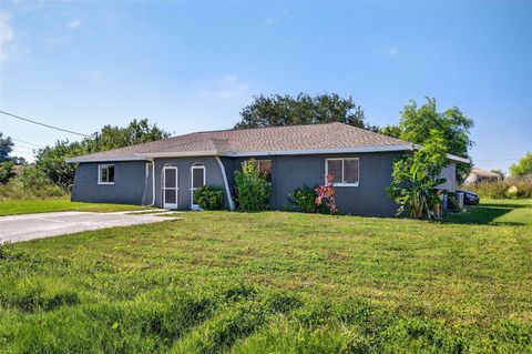 Photo of 1120 Gilbert Avenue S, Lehigh Acres, FL 33973 (MLS # C7517053)