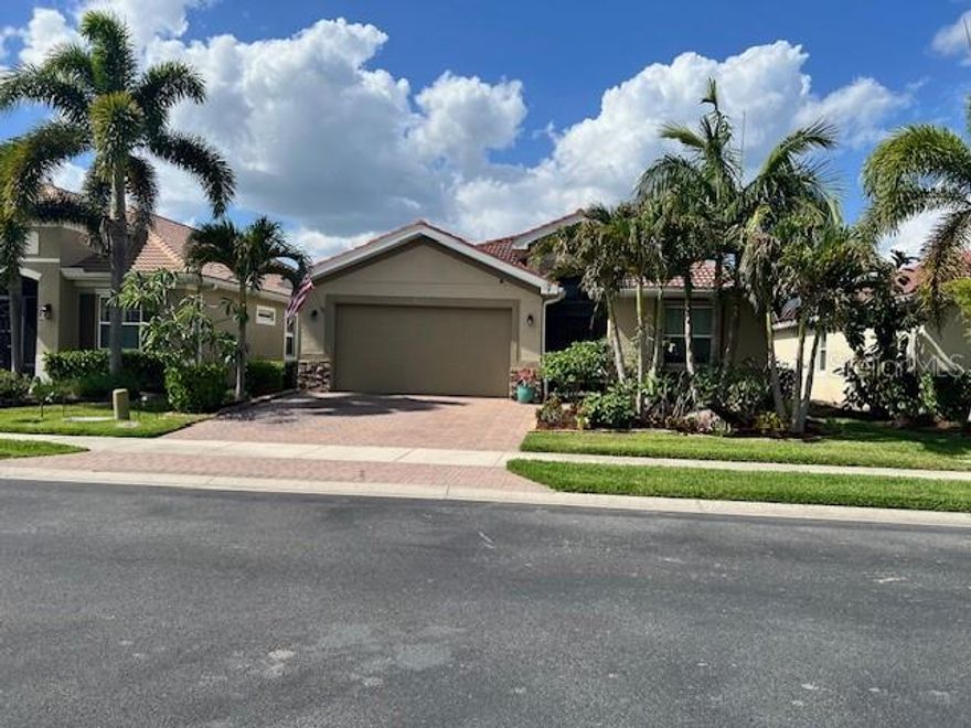 Step into this stunning waterfront pool home featuring the highly sought-after Edison 3-bedroom, 2-bath floor plan,
where elegance meets comfort.
Upon entry, you’re welcomed by a formal foyer with tray ceilings, sophisticated lighting, and crown molding
throughout, creating a warm and inviting introduction to the home’s design.
The open-concept great room flows seamlessly into the beautifully appointed kitchen, complete with stainless steel
appliances, granite countertops, elegant wood cabinetry, and a spacious corner pantry. An inviting eat-in dining
area provides the perfect space for gathering and entertaining.
The primary suite offers a peaceful retreat with tray ceilings, ambient lighting, dual walk-in closets, and a luxurious
ensuite featuring dual vanities, a soaking tub, and a walk-in shower.
Additional interior highlights include a dedicated laundry room and a versatile office or flex space with beautiful 8-
foot French doors—ideal for a home office, guest room, or creative studio.
Enjoy true indoor-outdoor living with a resort-style pool and spa, featuring a custom natural rock water feature,
enhancing your oasis style living (2021). All this surrounded by lush tropical landscaping. A beautiful black
aluminum fence encloses the backyard—perfect for pets to enjoy their own space too!
The home also features a two-car garage with custom wood shelving, offering ample storage and workspace.
Includes a custom rolling workbench for the craftsman enthusiast. Safety and protection haven’t been ignored
either with the addition of custom accordion-style hurricane shutters in 2025’ for added peace of mind and a manual transfer switch for a portable generator. Roof and HVAC are 2017.
Conveniently located less than 5 minutes from I-75 with easy access to Caribbean Village, Wellen Park, and a new
Benderson shopping center featuring Publix (coming soon).
Don’t miss the opportunity to make this exceptional home your own!