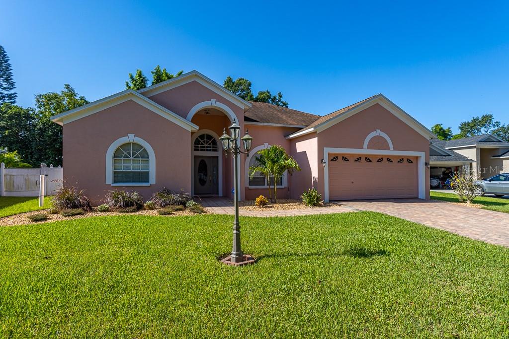 Imagine coming home to this beautifully maintained 3 bedroom 2 bath residence with a 2 car garage that is truly move-in ready. Located just minutes from Valrico Elementary, this home offers comfort and convenience in one perfect package.
Step inside to a bright open layout highlighted by soaring cathedral ceilings and a striking chandelier that adds elegance to the dining area. The kitchen boasts granite countertops, a pantry, and a convenient open concept kitchen and living-ideal for both everyday use and entertaining.
All bedrooms showcase hardwood floors, while the spacious primary suite offers a luxurious bath with a deep soaking tub and separate walk-in shower.
Relax or entertain on the screened lanai overlooking a sparkling pool and a private backyard filled with mature greenery and fruit-bearing trees. A cozy fire pit, built-in grill area, and utility shed complete the outdoor retreat.
Additional highlights include an in-ground sprinkler system and a generous two-car garage with a walk-up attic for extra storage. Close to shopping, dining, and entertainment—and just a short drive to airports, beaches, and world-class theme parks—this home perfectly captures the Florida lifestyle charm.