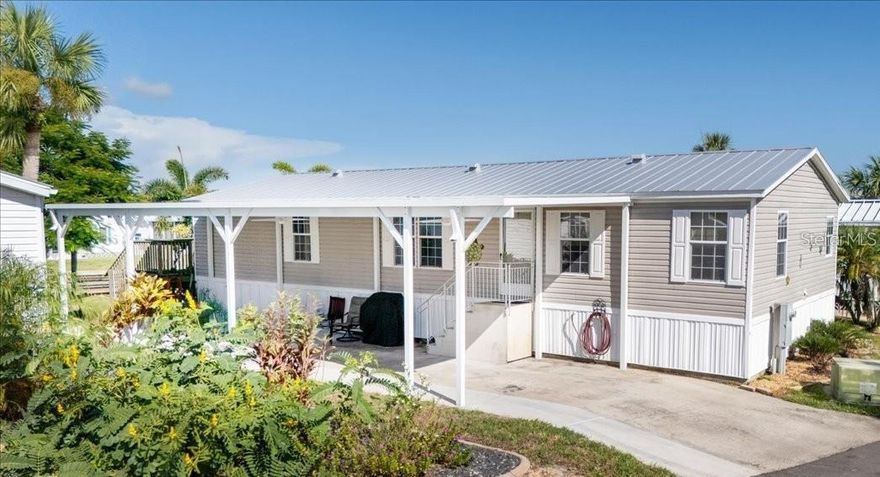 WATERFRONT LIVING AT ITS BEST – LAND OWNERSHIP! NO LOT RENT! Don’t miss this rare opportunity to own a beautifully maintained 3
bedroom, 2-bath home in Pelican Harbor Mobile Home Estates, one of the area’s most desirable 55+ waterfront communities. Perfect for boating, kayaking, and fishing enthusiasts, this property delivers the ultimate blend of comfort, convenience, and coastal lifestyle. Inside, you’ll find a spacious split floor plan filled with natural light. The primary suite features a walk-in closet and ensuite bath with dual sinks, soaking tub, and separate shower. The bright, open kitchen offers ceramic tile flooring, an eat-in bar, and abundant cabinet space. A dedicated laundry room adds everyday convenience. The bonus room expands your living area with sliders that open to a massive deck overlooking the water—a perfect spot for entertaining or simply enjoying the view. Upgrades include a metal roof, new spray foam insulation underneath, and newer A/C for improved energy efficiency. Enjoy the expansive open porch—ideal for relaxing or entertaining—along with your private dock, boat lift, and seawall for effortless waterfront access. Additional features include a new 48x16 covered carport with electrical. Community Amenities: Heated pool and clubhouse, shuffleboard, horseshoes, bocce ball, designated RV/trailer/boat storage, and inclusive water, sewer, and trash services. Ideally located near shopping, golf courses, entertainment, and top-rated dining—and just an hour to the world-famous Siesta Key Beach—this home offers both a serene retreat and an active waterfront lifestyle. Schedule your private showing today and experience the best of Florida living!