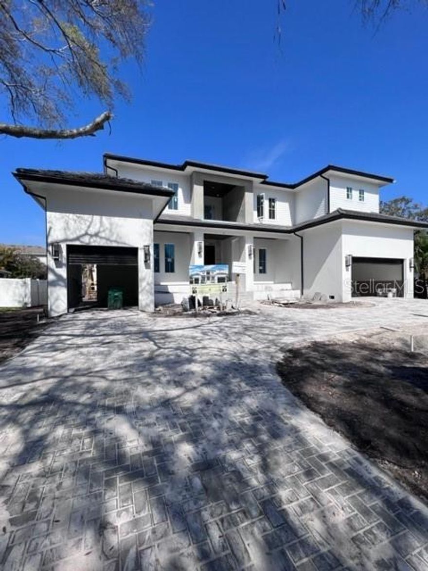 Under Construction. Stunning Sunset Park New Construction Pool Home built by Luxury Home Builder Brookshire Homes offers over 6100 sq ft with 5 bedrooms, 5 Bathrooms 2 Half Bathrooms, and a large 3 car garage. Sitting on an expansive 90x139 ft lot, this All-Block construction home was built with superior craftsmanship and of the highest quality. With a very versatile open floor plan downstairs you will find a spacious office, secondary laundry room, powder bath, guest suite with private full bath, Chef Style Kitchen with Thermador Appliances that opens to your large family room with gas fireplace and sliding glass doors overlooking pool area.  Upstairs you will find 3 large secondary bedrooms all with en-suite bathrooms, game room, main laundry room, and a master suite that will simply take your breath away.  Other features that come with this Gorgeous home are all white oak 7.5 " plank wood floors, Marble Countertops, Decorative wood cabinetry to the ceiling, 10ft Ceilings both downstairs and upstairs, Level 4 Smooth Drywall and so much more.  In the backyard you can relax under a large, covered lanai with tongue and groove wood ceilings which also features an Alfresco Outdoor Kitchen with grill, sink, beverage refrigerator.  Home to be completed early 2023. Call for Feature Sheet to see all the amazing high-end finishes that will be in this home.  Truly Impressive!!! This home is everything you have been searching for and more.