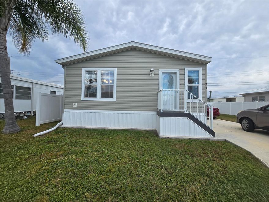 Wow! A 2024 BETTER THAN NEW UNDER 2OOK! 2 bedroom 2 bathroom beauty ready for its new owners. When the original property was removed and replaced, the owners envisioned and completely brand new oasis with no updates needed and they succeeded! Firstly, the location is a dream! Close to shopping, dining, entertainment and medical offices, and only 15 minutes from the ultra popular Anna Maria Island! In the active 55+ section of Fair Lane Acres, this home has many upgrades, starting at the top with updated shingles, designed to withstand up to 170 mph winds, and still under warranty! Gutter system was extended to lead any potential water away from the home. Upgraded storm doors in the main and side entrance will also keep you protected, and the double insulated walls will keep you cool in the summer and warm in the winter! When the current owners were creating this newer property barely 2 years ago, 11/2024 to be exact, they added many upgrades including extra windows and LED lighting, adding to the bright & open spacious feel. The current owners agree that ceiling fans and updated baseboards in the home were a necessity, so they added it already! Making it a move in ready dream. This home also features an open concept, with the living room, dining room & kitchen open and inviting for social gatherings or family time. Kitchen is spacious and has plenty of cabinetry for all of your storage needs and a deep sink facing the window. The laundry room and bedrooms are nearby with the primary bedroom at the end of the hallway. The carpeted primary has a spacious en suite bathroom and large closet. Guest bedroom is generously sized as well. With good space and a hanging closet for your clothes. Laundry room leads to the side entrance, and the oversized driveway can fit multiple cars and an extended paver slab is ready for summertime entertaining! Nice tall new vinyl fencing for privacy and storage sheds will remain for the new owners. Additional pavers and gravel walkway behind the home will help keep it all neat and organized! Sprinkler system has already been installed. The HOA is $134 a month and includes water and access to the clubhouse, pool, shuffleboard & sports courts. With 2 years of ownership, property can be rented. That gives you 2 years to enjoy our beautiful state, check out the beaches & springs, and see what we have to offer! Seller is ready to be closer to their family in another area of the state, come view this one today!