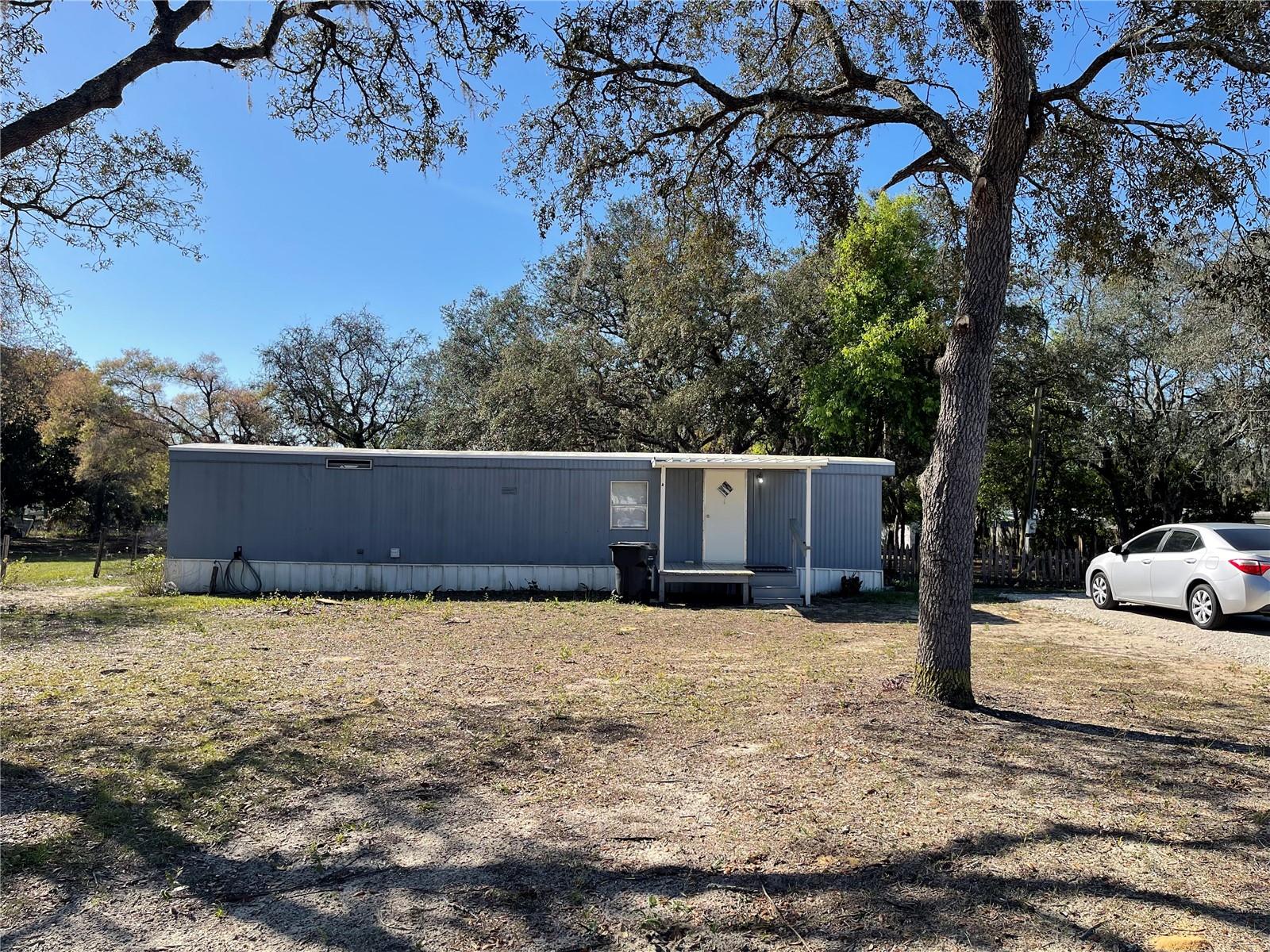 FL living at an affordable price or great investment property! This 2BD/1BA home is situated on 0.50 acres. Short distance to all shopping, schools, medical facilities, and restaurants. Make this your new winter retreat or year around home. Call today, don't miss this great investment opportunity.
