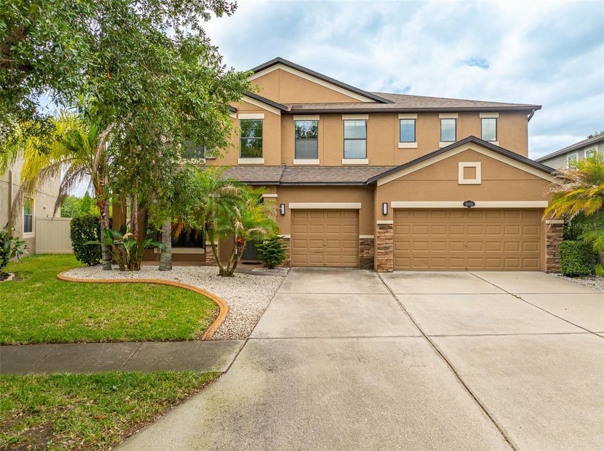 Welcome to this exceptional M/I Homes built residence, perfectly positioned on a premium homesite with tranquil conservation views and no rear neighbors—offering both privacy and a serene natural backdrop. With NO CDD and a low HOA, this beautifully maintained home combines space, functionality, and comfort in one impressive package.

Boasting 3,307 square feet of living space, this thoughtfully designed floor plan offers 5 generously sized bedrooms, 3 full bathrooms, and a large upstairs bonus room—ideal for a media room, playroom, or additional living space. A first-floor bedroom with a closet provides the perfect setup for guests, a home office, or multigenerational living.

The heart of the home is the spacious chef’s kitchen, featuring solid wood cabinetry, a double oven, stainless steel appliances, a large pantry, stylish backsplash, and an oversized breakfast bar/island—perfect for gathering and entertaining. The kitchen flows seamlessly into the expansive living and dining areas, enhanced by abundant natural light and an open-concept layout.

Step through sliding glass doors to the covered and enclosed lanai, where you can relax and unwind while enjoying the fully fenced backyard. With plenty of room to add a pool, this outdoor space is ready to become your own private oasis. A new sauna on the patio adds an extra touch of luxury and relaxation.

Upstairs, you’ll find four additional bedrooms along with a spacious bonus room. The primary suite is a true retreat, featuring a tray ceiling, dual vanities, a custom walk-in closet with built-in organization, a garden tub, and a separate shower.

Additional highlights include hurricane shutters, a three-car garage with ample storage, and an extended driveway for additional parking.

Conveniently located near top-rated K–12 public and charter schools, the FishHawk Sports Complex, YMCA, St. Joseph’s Hospital, shopping, dining, and major highways—with easy access to MacDill AFB—this home offers both comfort and convenience.