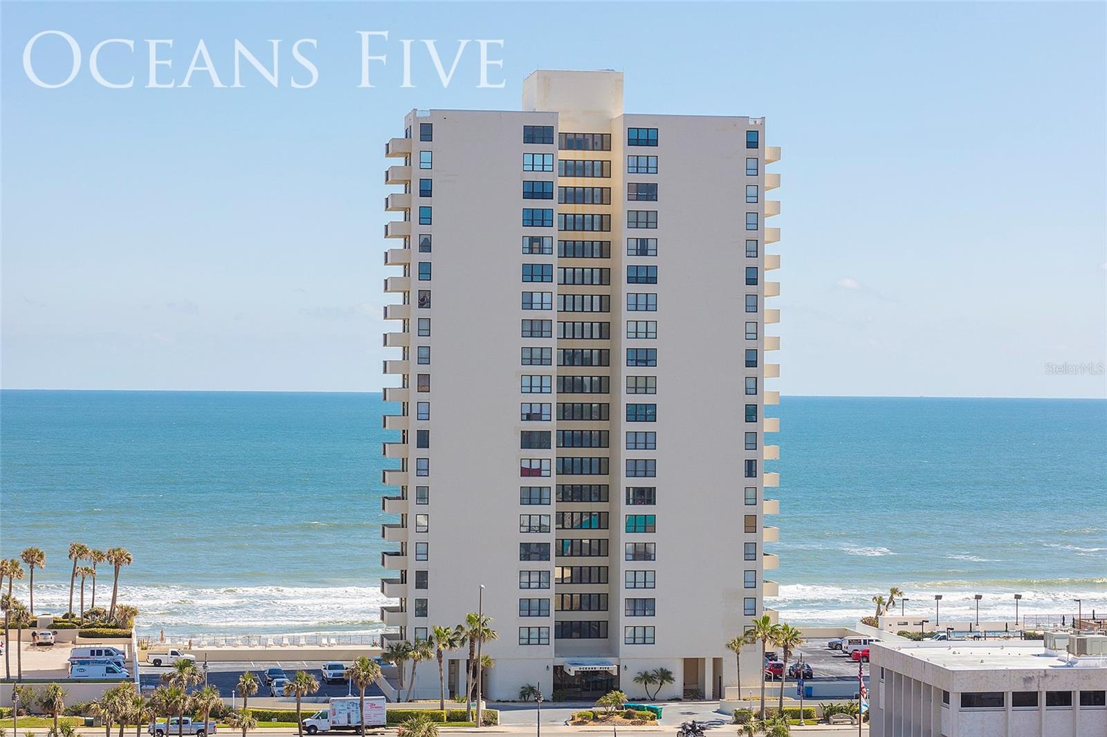 **More than $4.4 Million in Renovations at Oceans Five - All Assessments Paid! FURNISHED!** Are you looking for your beach escape in 2025? This oceanside gem is among the most affordable options in highly-desired Daytona Beach Shores. Envy-worthy southeast corner beach and river views set your daily scene from the balcony, living room, and both bedrooms! Tile flooring adorns the living areas while the kitchen provides quality appliances and upgraded cabinetry. Oceans Five is a convenient oceanfront condo community near shopping, dining and more. Residents of Oceans Five enjoy community amenities that include a beachfront swimming pool and deck, a fitness room, a social room, and opportunities for golf, pickleball and tennis across the street. Don't miss out on this beautiful condo in the heart of all that Daytona Beach Shores has to offer.