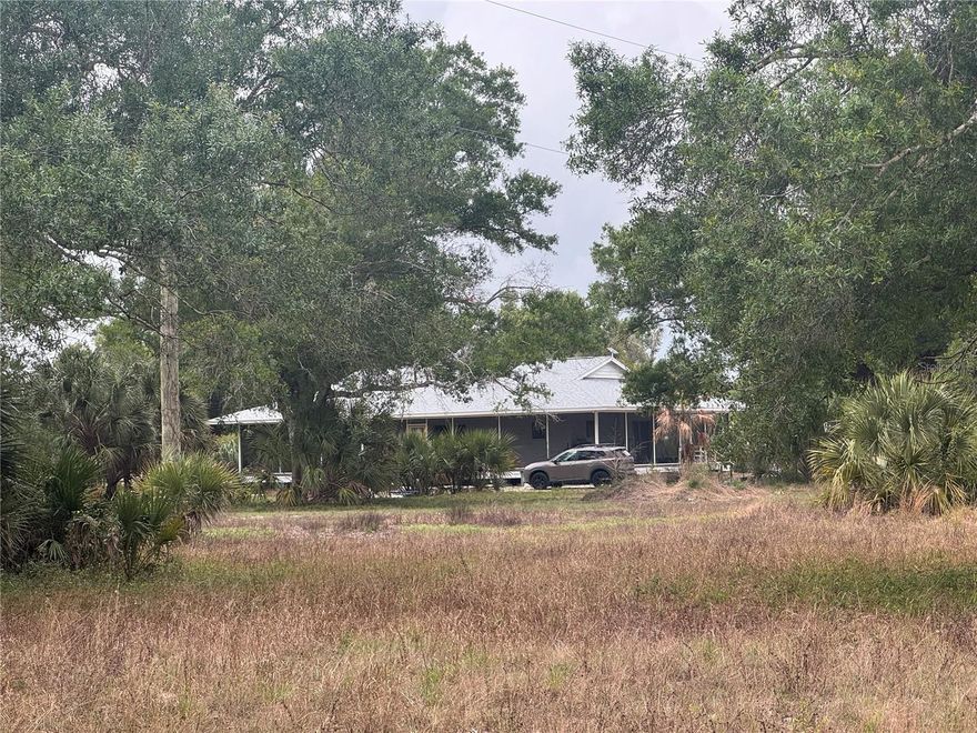 RARE 10-ACRE PRIVATE RETREAT | MOVE-IN READY | NOTHING LIKE IT AT THIS PRICE IN ALL DESOTO COUNTY
Escape the ordinary and own your own slice of Old Florida. Tucked away on nearly 10 fully fenced and beautifully wooded acres, this unique property delivers the privacy, space, and quality construction that buyers have been searching for — and simply cannot find anywhere else at this price point. No mobile home, no flood zone, no HOA!
The 2-bedroom, 2-bathroom home offers 1,274 sq ft of living area and 2,668 sq ft under truss, with a signature wrap-around screened porch that practically doubles your living space and defines true Southern living. 
Extensively Updated — The Heavy Lifting Is Done: Major capital improvements have already been completed, including a brand new roof and insulation (2026), new Andersen windows (2025), a new septic system (2021)-upsized and ready for your future plans, fully renovated bathrooms, new well equipment, electrical upgrades with a 50-amp whole-house generator hookup, plumbing updates, and a propane tankless water heater. The kitchen features a premium Sub-Zero refrigerator with a separate under-counter freezer.
Versatile Infrastructure for Endless Possibilities: The property includes three tiny home cabins with electricity and A/C — a 12x32 workshop/shed, a massive parking and work area ideal for contractors, heavy equipment, or event parking, irrigation already run across portions of the property, and conduit pre-installed for future electrical expansion.
Location Without Compromise: Just 12 minutes to shopping in Arcadia and 25 minutes to Babcock Ranch's growing corridor of shops and restaurants — close to everything, but you'd never know it once you're home.
Motivated sellers. Come see today!