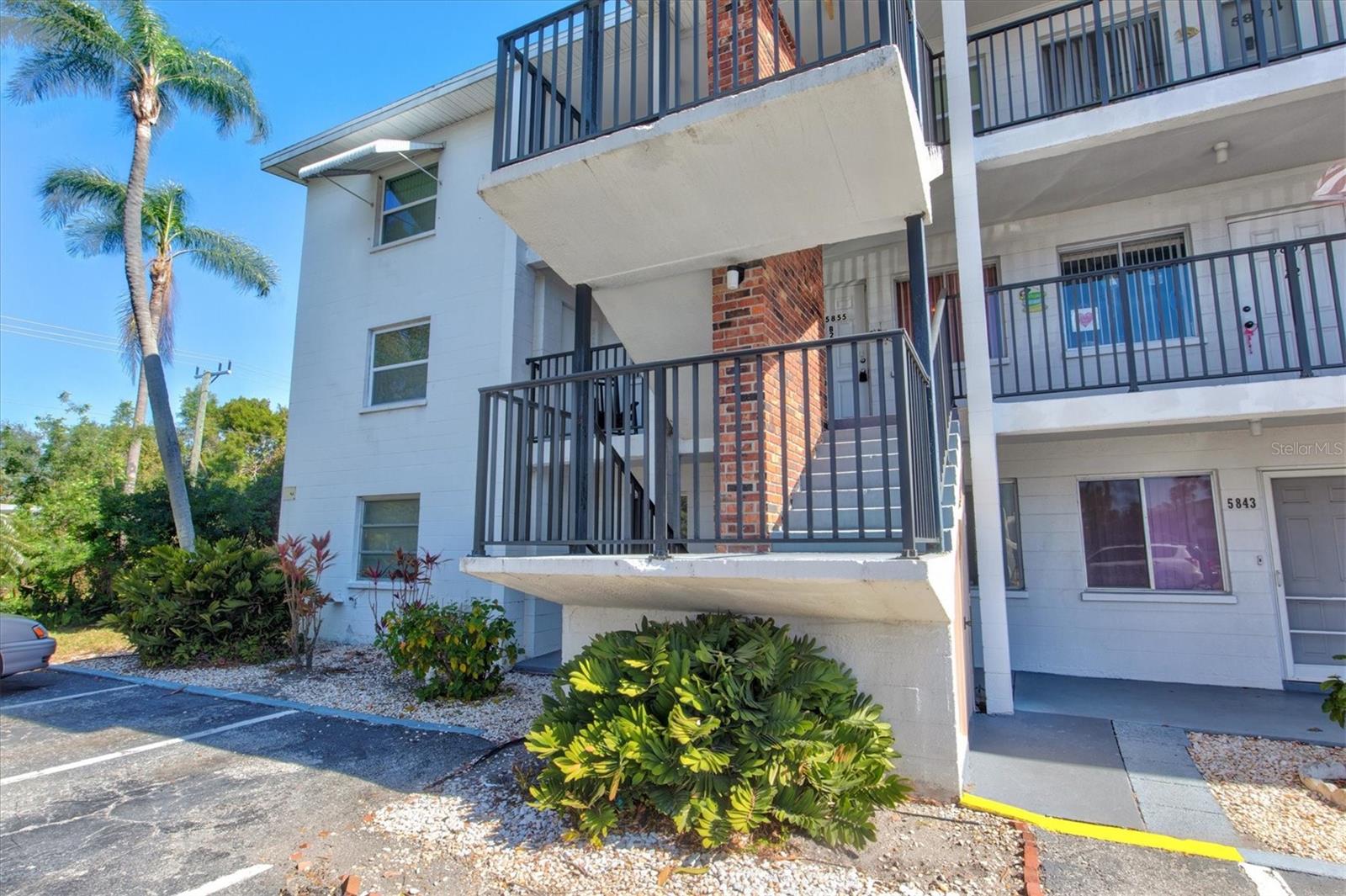 Nestled in the vibrant Bayshore Gardens Condominiums, this charming condo is full of potential, offering a fantastic opportunity to make it your own! Located on the second floor in a 55+ community, this home provides a cozy and inviting space, perfect for year-round or seasonal Florida living. You'll love the privacy of this corner unit, with only one shared wall and a charming sitting area right outside the front door, perfect for relaxing and enjoying the surroundings. As you step into the threshold, your heart will surely be captured. This charming home boasts several key upgrades, including two recently replaced hurricane windows and a brand-new A/C unit installed just months ago. Enjoy stylish and durable laminate flooring installed in 2021, along with a new hot water heater from the same year. The bathroom was tastefully updated in 2021 with a new shower, commode, and fresh paint. Entertain with ease as the kitchen has access through both the dining room and hallway paired with lots of countertop space plus a closet pantry. Whether you're a gourmet chef or a casual cook, this kitchen has everything you need to create delicious meals. Welcome fresh air and natural light into your home with the enclosed and screened patio, perfect for savoring your morning coffee or indulging in a refreshing evening drink while enjoying the Florida foliage that surrounds you. Making your way to the Owner's Suite, experience the luxury of space with a king-size bed that fits effortlessly in the room with a private closet. You'll have plenty of room to relax and unwind in your private retreat featuring a private ensuite. Plenty of storage space with linen closets. An added bonus is the fact this unit has washer and dryer INSIDE the home. No more lugging your laundry to the community laundromat! This welcoming community offers both stairs and an elevator for your convenience, along with outdoor storage facilities. You'll find yourself just a few steps away from the heated swimming pool, the community office, and a shuffleboard court, making it effortless to entertain guests. Begin your day with a cup of coffee on your private balcony, extending your living space. The low monthly maintenance fee covers a host of essential amenities, including basic cable, common area taxes, access to the community pool, a fidelity bond, grounds and exterior maintenance, the services of a community manager, and trash removal. Please note that Bayshore Gardens does not permit pets, and unit rentals are subject to the condo association's policies, available after three years of ownership, with no short-term rentals allowed. Situated conveniently close to Bayshore Gardens Parkway, you'll enjoy easy access to abundant shopping, an array of restaurants, entertainment options, and medical facilities. Plus, you're only a 15-minute drive from the renowned Gulf Beaches, and I-75 is within easy reach. This property is not just a condo; it's a haven of comfort and style. With the remarkable upgrades and maintenance free community, you'll experience the ultimate modern living lifestyle. Don't miss the opportunity to make this your home sweet home.