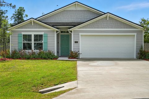 Photo of 18 Poplar Drive, Palm Coast, FL 32164 (MLS # FC312156) Photo of 18 Poplar Drive, Palm Coast, FL 32164 (MLS # FC312156)