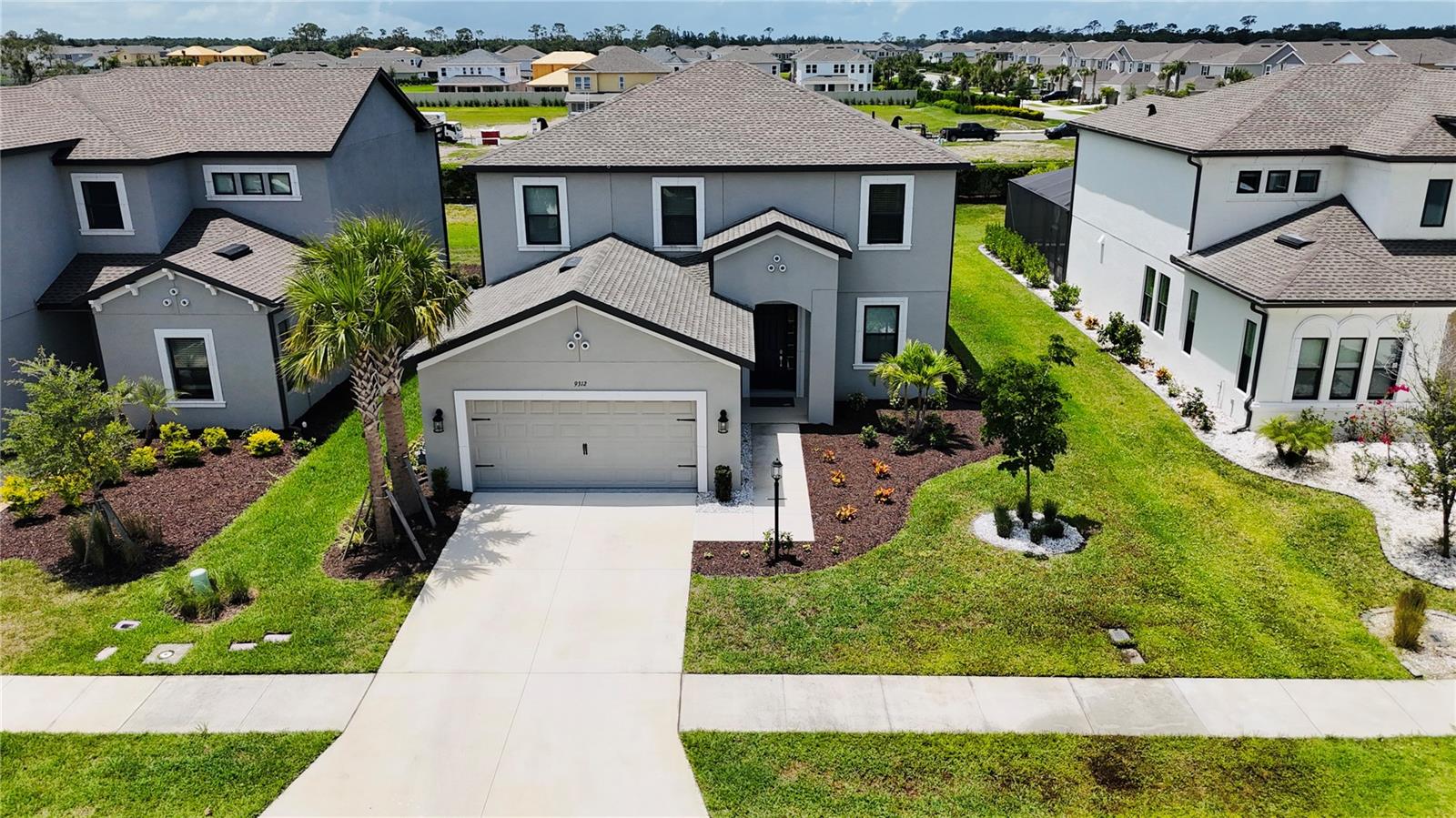 Better than new and beautifully upgraded, this 2023-built home at 9312 Tequila Sunrise Dr in the sought-after gated community of Cassia at Skye Ranch offers luxury, comfort, and convenience. Lightly lived in and meticulously maintained, this Turnkey Furnished home features 4 spacious bedrooms (with the primary suite on the ground floor), a dedicated office/den, a generous loft, and 3.5 bathrooms, perfect for today’s flexible lifestyles.
A package of approximately $35,000 worth of brand-new quality furnishings and high-end upgrades is included with the sale, offering a true turnkey, move-in-ready experience. This package features stylish furniture, mounted flat-screen TVs, and premium appliances such as an LG front-load washer and dryer with pedestals and an upgraded counter-depth refrigerator with a beverage center. Additional enhancements include multiple ceiling fans on the lanai, custom window treatments, a hard-wired security system with a Ring doorbell, an epoxy-coated garage floor with a wash basin, Cushion Close cabinetry, automatic night lights throughout the home, cabinet and furniture liners in all drawers, and custom stove and oven liners.
The gourmet kitchen is a true centerpiece, boasting a counter depth refrigerator and beverage center, cushion-close cabinetry, and stylish finishes. Enjoy seamless indoor-outdoor living with a covered lanai enhanced with ceiling fans, perfect for relaxing evenings. The two car garage is thoughtfully upgraded with an epoxy-coated floor and utility sink and has never been used for parking.
Cassia at Skye Ranch is one of Sarasota’s most vibrant master-planned communities, offering resort-style amenities, including a clubhouse, pool with splash pad and lap lanes, spa, fitness center, rock climbing wall, indoor and outdoor sports courts, parks, playgrounds, dog park, scenic walking trails, and year round social events organized by a dedicated Activities Director.
Families will appreciate being zoned for Riverview High School and the brand-new Skye Ranch K-8 School, conveniently located adjacent to the community.
This is a rare opportunity to own a truly move-in-ready, upgraded home in one of Sarasota’s most exciting neighborhoods.