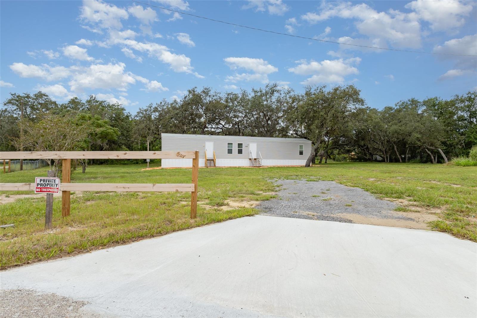 2023 Mobile Home Like New and Fully Furnished! Affordable country living with room to spread out! This beautifully maintained home sits on a private .75-acre lot, offering the perfect blend of peace, freedom, and convenience. Enjoy the space to bring your toys, RV, boat, or work vehicles, with no HOA or deed restrictions, the possibilities are endless. Just a short drive from town, you’ll love having quick access to shopping, dining, and everyday essentials while still soaking in the quiet charm of rural living. With this much land, flexibility, and value, this property won’t last long, schedule your private showing today!