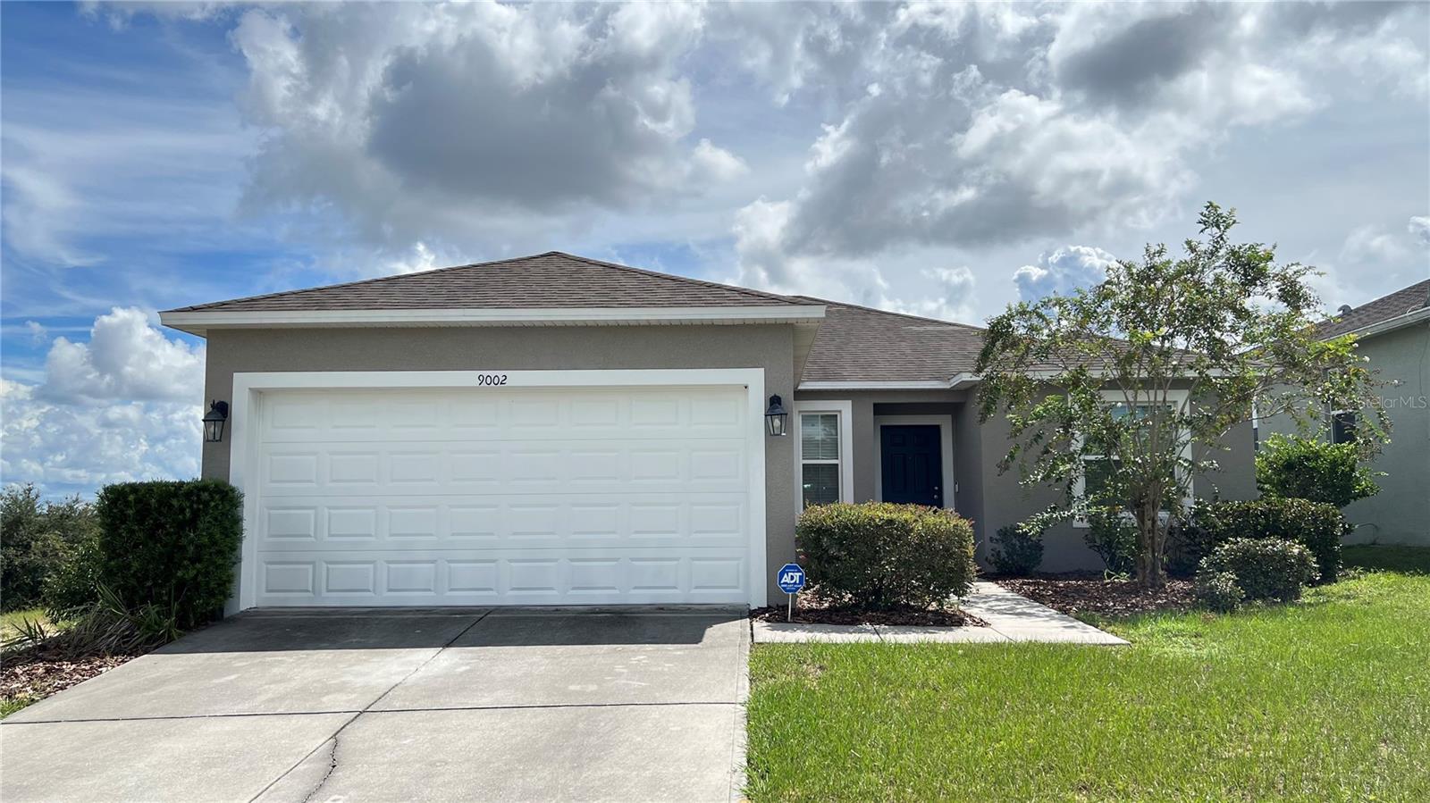 This is a spacious 4-bedroom, 2-bathroom single-family home located at 9002 Orange Blossom Loop, Haines City, FL 33844. This beautiful property features an open floor plan with the kitchen flowing seamlessly into the living room and a cozy dining nook, perfect for everyday living and entertaining. The primary suite offers a large walk-in closet, dual sinks, and a walk-in shower, while the additional bedrooms provide plenty of space for family or guests. A full-sized washer and dryer, along with a two-car attached garage, add to the convenience of this home, and lawn care is included in the monthly rent. Ideally situated near Highway 27 and just minutes from Posner Park’s shops and restaurants, this home combines comfort, style, and location—schedule your showing today!