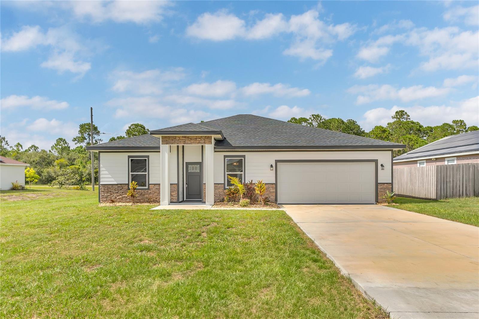 Welcome to this beautiful new construction home at 17 Herring Ct in Poinciana, ready for immediate move-in. This 3-bedroom, 2-bathroom house offers 1,768 square feet of comfortable living space with modern upgrades throughout.
The heart of the home features a spacious kitchen with granite countertops, a large island, and 42-inch soft-close cabinets. Stainless steel appliances complete the kitchen's clean, updated look. Ceramic tile flooring flows throughout the home, paired with elegant 5-inch baseboards that add a polished touch to every room.
The primary bedroom provides a peaceful retreat, while the primary bathroom offers convenience with dual sinks topped with granite counters. The second bathroom also features attractive tile work, maintaining the home's consistent style.
This property stands out with its move-in ready condition and quality finishes. The granite surfaces, upgraded cabinetry, and tile flooring create a fresh, contemporary feel perfect for today's lifestyle. The open layout maximizes the home's square footage, providing plenty of room for daily living and entertaining.
Located in Poinciana, this home offers the benefits of new construction with the convenience of immediate occupancy. No waiting for completion or dealing with construction delays. The attention to detail in the finishes and the practical layout make this an excellent opportunity for buyers seeking a turnkey home.
Don't wait to see this well-appointed property that combines modern amenities with comfortable living spaces, all ready for you to call home today.