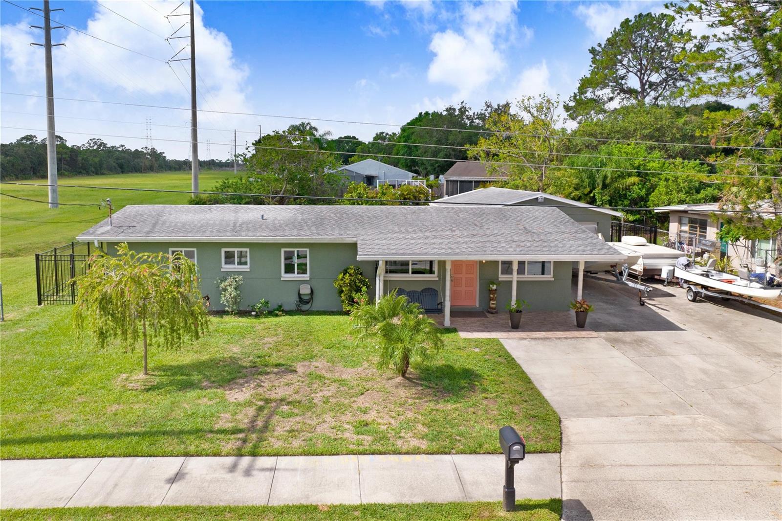 Under contract-accepting backup offers. IMMACULATE AND WELL MAINTAINED 4 Bedroom, 2 Bathroom 4 car garage block home situated on a Cul-de-sac and next to the Mobbly Bayou Wilderness Preserve in the beautiful town of Oldsmar. As you enter this newly remodeled home, you will appreciate the abundance of natural light, wood-plank tile flooring and neutral tones throughout. The open concept floor plan offers a Kitchen, Dining Room and a Family Room, that flow together making it a perfect place for gathering and entertaining. The kitchen offers, WOOD CABINETRY, GRANITE COUNTER TOPS, STAINLESS STEEL APPLIANCES, A BREAKFAST BAR, and a MOSAIC GLASS TILE BACKSPLASH. The trendy shiplap breakfast bar and designer light fixtures give this beautiful kitchen a modern vibe. On the right side of the house, you can find a spacious Master Bedroom and an En-Suite Bathroom, beautifully updated with GRANITE COUNTER TOPS, DECORATIVE ACCENTS AND A TILED STEP-IN
SHOWER. On the left side of the house, there are 3 nicely sized Bedrooms and an updated Bathroom. Towards the back of the house, French Doors, lead from the Family Room to the air-conditioned Florida Room with Laundry Room, that overlooks the HUGE FENCE BACKYARD WITH A BRAND-NEW WROUGHT IRON FENCE. The 200 SQFT air-conditioned garage can fit multiple vehicles, Golf Carts, ATV’s, etc.. Some of the great features of this home include: NEW A/C (2018), NEW WHIRLPOOL APPLIANCES (2018), NEW WATER HEATER (2018), NEW-FULLY FENCED YARD (2022), NEW HURRICANE WINDOWS (2020/2023), REMODELED KITCHEN AND BATHROOMS (2018). Enjoy the ¾ mile walk through the beautiful preserve that leads to The Mobbly Bayou Beach Park. Nearby, you will also find the Bicentennial Park, RE Olds Park (Dogs Parks, Fishing Pier, Picnic Tables, Volleyball court and more) Veterans Memorial Park and The Oldsmar Boat Ramp, which leads to Tampa Bay. Close to restaurants, shops and short drive to Tampa International Airport and Downtown. Make an appointment today to see this move-in-ready home. Swing in the front porch do no convey.