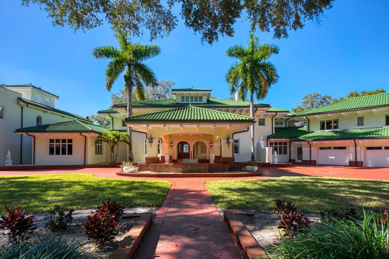 A Stunning Achievement in Design and Location Beyond Comparison. Incomparable Gulf views, dramatic architectural details and a highly coveted location combine for the height of luxury in this Mediterranean masterpiece overlooking the widest expanse of Clearwater Harbor. “Century Oaks” is the namesake of this storied estate that has entertained U.S. presidents, heads of state and is located on the grounds of the Ft Harrison used during the Spanish – American war. Commanding an unmatched 5.6 acres with 213 feet of direct waterfront, the 16,472 square foot mansion presents a rare opportunity to own one of the most iconic mansions in the state of Florida. Strategically positioned atop a large bluff, the sprawling residence was purposefully built to capitalize on vistas spanning Eye of the Gulf, Sand Key and the Clearwater skyline. Soaring cathedral ceilings, multiple windows and an expansive open plan create a welcoming setting for luxurious family living and entertaining—whether your guest list numbers two or 200. Truly an achievement in design and décor, the stunning 10-bedroom residence combines the artistry and grandeur of old world elegance with the sophistication and convenience of modern amenities. Beyond the distinguished porte cochere, the two-story layout offers a pleasing blend of formal and informal spaces which can accommodate any entertaining need including a grand entry hall, massive ballroom, banquet-size dining room and an inviting family room. Serving any occasion is the kitchen, equipped with everything a professional chef requires including a AGA cast iron range, two warming ovens, Subzero refrigerator, coffee station, breakfast bar, work island and casual dining space. Morning coffee is best served on the balcony as boats sail by and dolphins play steps away from your backyard. Evening cocktails become elevated on the entertainment terrace when gazing at a technicolor sunset over the sparkling waters of the Gulf of Mexico. Residents can enjoy numerous activities at home as the property includes a plush home theater, tennis and basketball courts, two swimming pools and two deep water docks that can accommodate yachts up to 60 feet. Augmenting the main house are two equally elegant guest homes. This peerless setting of waterfront splendor is conveniently located near cultural and entertainment venues, fine dining and shopping and award-winning Gulf beaches. Tampa International Airport is just a short drive away. Adjacent properties to the north and south (800 and 820 Druid Road) are available for purchase creating a large compound opportunity.