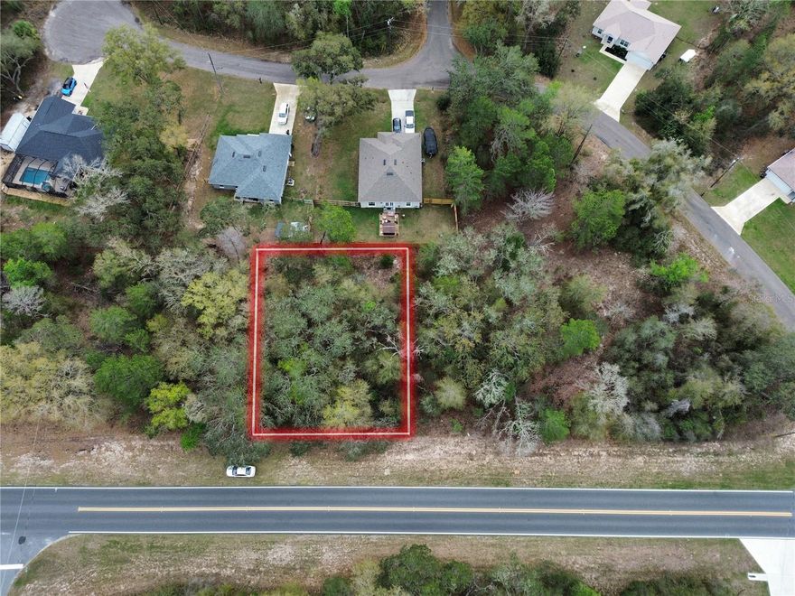 Wooded 0.25-acre lot located in the established Silver Springs Shores neighborhood, near Ocala. Features 100' of frontage on Bay Road and 110' depth, zoned R1 for single-family residential. Flood Zone X, no flood insurance required. Access via paved county-maintained road. Lot is raw land; buyer to install well and septic. Electric available through Duke Energy. Approximately 2.7 miles to Lake Weir.
Parcel ID: 9038-1260-15 Coordinates: 29.05039508, -81.90627439
