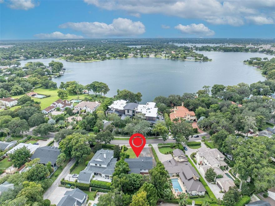 This expansive .32-acre lot (13,732 sq ft) offers exceptional potential for either a brand-new custom build or a renovation with room to expand. Ideally located in the heart of Winter Park, the property sits across the street from several grand estates on the Winter Park Chain of Lakes, offering both prestige and endless possibilities. The existing 1960’s residence features original wood floors, a generous living area, and a split-bedroom layout—ready for updates or thoughtful expansion. With ample space, you can reimagine the home to suit your lifestyle or design a stunning new construction. Adding to its appeal, the property is within a short stroll to Kraft Azalea Gardens, the Winter Park YMCA, Phelps Park and just a little over a mile from Downtown Winter Park’s shops, dining, and cultural venues.  This home is sold AS IS.