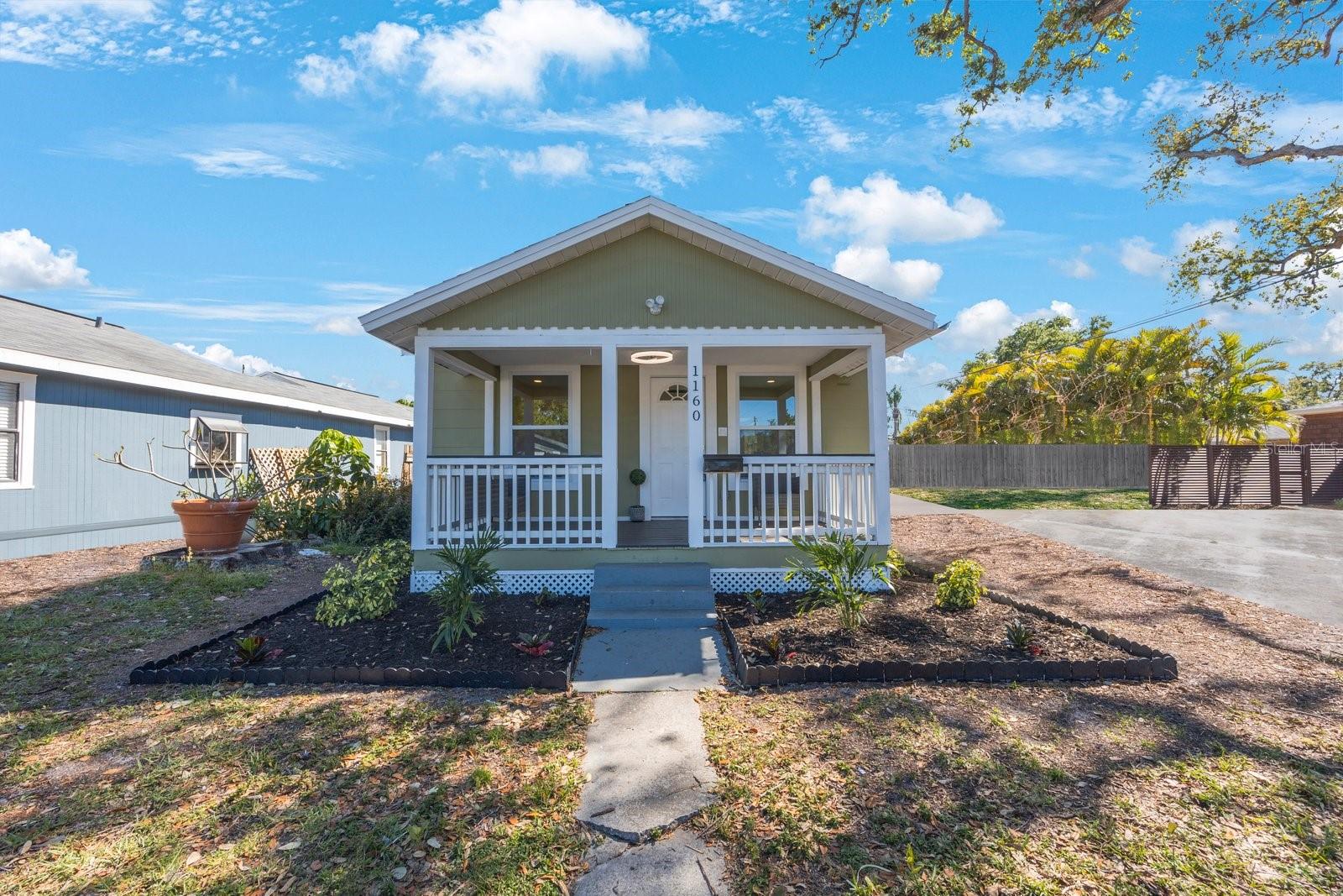 High and dry no flood and no storm damage. Welcome to a beautifully updated 2-bedroom 1 bathroom bungalow in the desirable Magnolia Heights neighborhood. The house blends modern updates with timeless charm, offering an inviting open floor plan and stylish finishes throughout. Step onto the cozy front porch, then walk into a bright and airy living area that seamlessly flows into a fully remodeled kitchen featuring quartz countertops, gold fixtures, stainless steel appliances, and a breakfast bar with extra cabinet space. The entire home boasts luxury vinyl flooring, providing both durability and elegance. The stunning bathroom is a true showstopper, with floor-to-ceiling tile, a sleek walk-in shower with glass doors, and a designer dresser vanity with a white countertop, all complemented by matching gold fixtures. This home is not just beautiful—it’s built to last! Enjoy peace of mind with hurricane-proof windows, 2018 Roof, 2017 A/C, and all New Electrical. Walk out into a Large screened-in patio perfect for relaxing or entertaining. Additionally, this property has an Oversized detached garage with a new door & laundry area. There is a spacious yard as well with plenty of parking. Located just 5 minutes from 4th Street and 10 minutes from Downtown St. Pete, you’ll have easy access to top-rated restaurants, shopping, and entertainment. Don’t miss out on this beautifully upgraded home in one of St. Pete’s most desirable neighborhoods! Schedule your showing today!