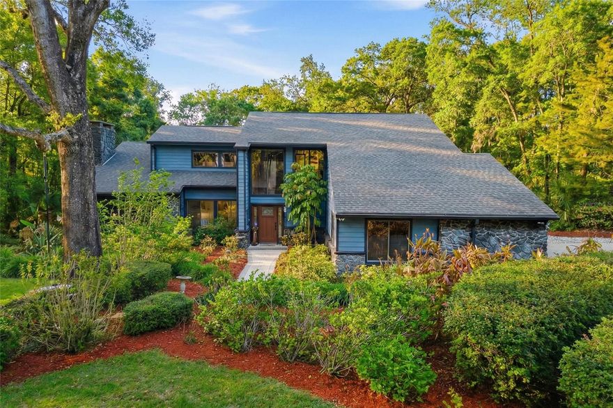 Welcome to this Exquisite 3 Bedroom 3 Bath Pool home with an Oversized 3 Car Garage on 2.18 Wooded Acres in Exclusive Oak Hollow subdivision in Beautiful Apopka! Meticulously landscaped and a true country feel with so many amazing features in this custom home. A lengthy brick paver driveway to a huge 3 car garage, luscious landscaping to the front entry, a grand entrance with an elegant staircase, huge vaulting with tongue and groove ceilings & wood beams with one-of-a-kind custom stained glass features in the family room! It keeps going, hardwood & imported brick flooring, stone accented wood burning fireplace, book shelves, perfectly planned skylights & window placement for natural lighting, WIFI thermostats, outdoor kitchen with a commercial grade refreshment cooler, gas grill and firepit in the lanai/FL room, updated pool equipment and SO MUCH MORE! From the entry and Up the stairs leads you to the primary and second bedroom, loft and office. All have many unique features and have been remodeled with top tier taste and quality craftsmanship. The loft bedroom overlooks the fireplace and custom stained glass features and is the segue to the office. This bedroom is huge with cedar ceilings, luxury & vinyl flooring. The primary bathroom is magazine quality and features a high end smart toilet and clawfoot tub with a beautiful window view and its own skylight, his and hers sinks, custom shower, bidet, tile floors, and a walk-in closet. The office has custom wood cabinets and shelving for all your space and storage needs and the view from the window makes work from home as good as it gets! The second bedroom gets tons of natural light and the bathroom is nicely done with a granite countertop and tile floors. Lets party downstairs-This luxury home was designed to host the very best get-togethers. The main kitchen is a chef's dream with LOTS of solid wood Kraftmaid cabinets, quartz countertops, stainless steel appliances, centrally located island with a cooktop bar, GE convection oven & microwave combo, new fridge, dishwasher, dining area to the side, with a pass-through window at the kitchen sink to the Florida room that keeps everyone connected during your parties. The huge Florida room overlooks the high end pool, paver decking, and professionally landscaped back yard and is loaded with features that will make you never want to leave home. The outdoor kitchen features a built in commercial grade refreshment cooler, sink, granite countertops, Alfresco gas grill, 3 new ceiling fans, TV, gas firepit, and the keyless entry 3rd Bathroom is perfectly placed with access from the pool/Florida room or first floor off the kitchen area. Your 3rd bedroom is located downstairs and is perfect for your guests privacy for a split design feel. This home has been well maintained and the pride of ownership is evident.  The newly fenced in backyard is your own nature sanctuary but your lot is actually SO MUCH BIGGER than the fenced part. There is a 12x16 shed for storage and with OVER 2 acres plenty of room to build the shop of your dreams. Super close to Kelly Park, Kings Landing, Wekiva State Forest, 429, Publix, restaurants, ~36 min to Universal or be at the beach in about an hour. Come see this Florida dream home today!