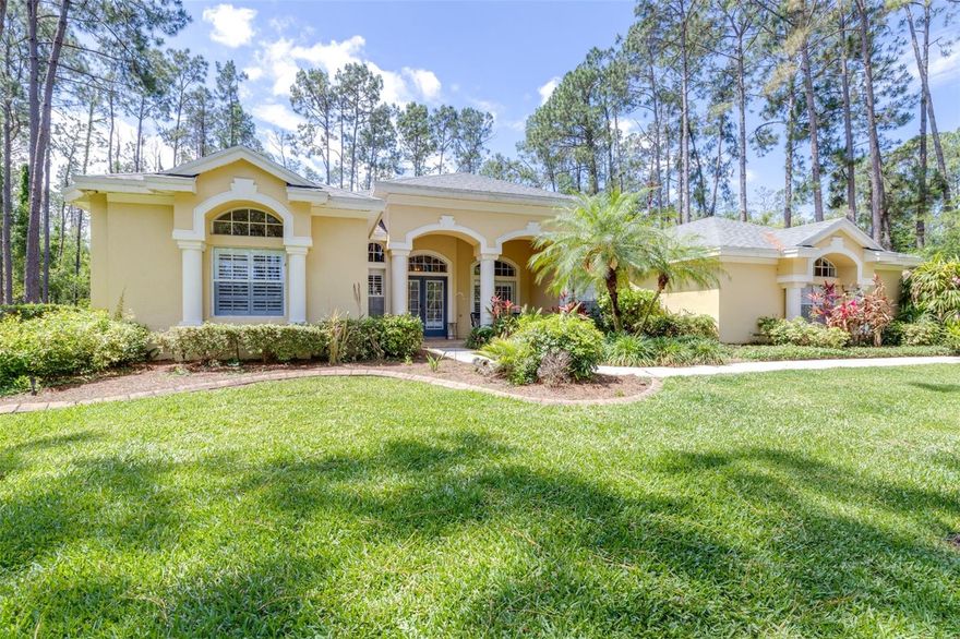 Your Florida dream awaits, nestled in the exclusive, gated community of Pine Crest Estates! This meticulously maintained 4-bedroom, 3-bathroom, 3-car garage home offers the perfect blend of comfort, functionality, and upscale living, all set on over an acre of beautifully kept property. The home has been thoughtfully updated with a Generac generator powering the entire house, newer roof and A/C (each approx 3 years old), and electrical panel/GFI outlets (approx 6 months old each.) 
In addition to the spacious bedrooms, is a dedicated bonus office-ideal for remote work, a study, or creative space. The home boasts motorized window treatments, to add a touch of convenience and luxury throughout, while the renovated bathrooms showcase stylish, contemporary finishes. A wood burning fireplace, and large den completes the lavish feel. The expansive 3-car garage includes a Tesla charger, as well as its newly finished epoxy floors, combining durability with a clean, polished look. 
Step outside to your private retreat, where a screened-in lanai encloses a sparkling, fully heated saltwater pool and relaxing hot tub-perfect for year-round enjoyment and entertaining. Equipped with a newer pool heater and canopy, offering peace of mind and modern efficiency. This property truly delivers a move-in-ready experience with high-end upgrades and exceptional attention to detail.