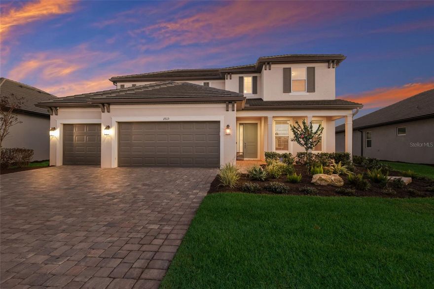 This modern pool home situated in the highly desirable Sweetwater neighborhood in award-winning Lakewood Ranch exudes luxury & elegance every step of the way! Meticulously maintained and nearly new, this stunning 4-bedroom, 3.5-bath Juniper floorplan by M/I Homes is loaded with upgrades and perfectly positioned on a lushly landscaped lot with southern-facing pond views and peaceful conservation in the distance. The curb appeal is undeniable, with its British West Indies inspired elevation, modern ceramic flat tile roof, pavered driveway, & inviting front porch. Step inside to a dramatic, soaring foyer open to the second floor, accented by custom wood wall trim for an elegant, finished look. A versatile den just off the foyer offers the perfect flex space, ideal for a home office, media room, or playroom. Beyond the foyer is your open concept gourmet kitchen, formal dining room, Great Room, and Kitchen Cafe. The large designer kitchen showcases staggered 42" cabinets, stainless vent hood, quartz countertops, natural gas cooktop, double wall oven, tile backsplash, & oversized walk-in pantry. The Cafe easily accommodates everyday dining, while the formal dining room is ideal for upscale gatherings, enhanced by a custom dry bar with built-in wine fridge and wine racks. Your Great Room dazzles with its tray ceiling, sparkling chandelier, and stunning custom marble and stacked-stone fireplace wall. Impact sliders from the Great Room lead you to the crown jewel of the home...your GORGEOUS, extended, screened-in lanai and heated saltwater pool with cascading waterfall feature & water bowls. The custom outdoor kitchen is an entertainer's dream & includes fridge, wine fridge, gas grill, & 2 burners. Enjoy serene, southern-facing pond views, a backdrop of tropical landscaping, & privacy hedging that transforms this space into a true backyard retreat. Imagine relaxing under the pergola with your favorite beverage in hand while you watch the sunset in the distance! Back inside, the impressive oversized Primary Retreat delights with its tray ceiling & crystal chandelier. Your Primary Bath includes extended vanity w/quartz counters, double sinks, custom vanity lighting, walk-in shower w/floor to ceiling tile, soaking garden tub, & HUGE walk-in closet. Venture upstairs and you'll find the spacious loft/game room, two additional bedrooms with a shared hall bath, and a fourth bedroom that serves as a private Guest Suite with its own walk-in closet & full en-suite bath. One of the bedrooms is brilliantly styled as a home theatre, complete with custom accent slat wall. A stylish powder bath sits just off the foyer for guests, while a HUGE Super Laundry Room just opposite impresses with built-in upper & lower cabinetry and a generous bonus area - perfect for a home gym, pet care station, or extra storage. Other notable features include: Impact windows throughout; Custom designer lighting; Custom window treatments; In-ceiling speakers; Security system on windows & doors; Epoxy floors in garage; Tankless gas water heater & more! Residents of the gated Sweetwater community enjoy access to a world-class amenity center featuring a resort-style pool, fitness center, pickleball & sports courts, a vibrant clubhouse/social hall, & more. Primely situated in Lakewood Ranch, the #1 multigenerational community in the U.S., with top-rated schools, shopping, dining & entertainment nearby, easy access to I-75, & less than 40 minutes to Siesta Key Beach & Anna Maria Island.