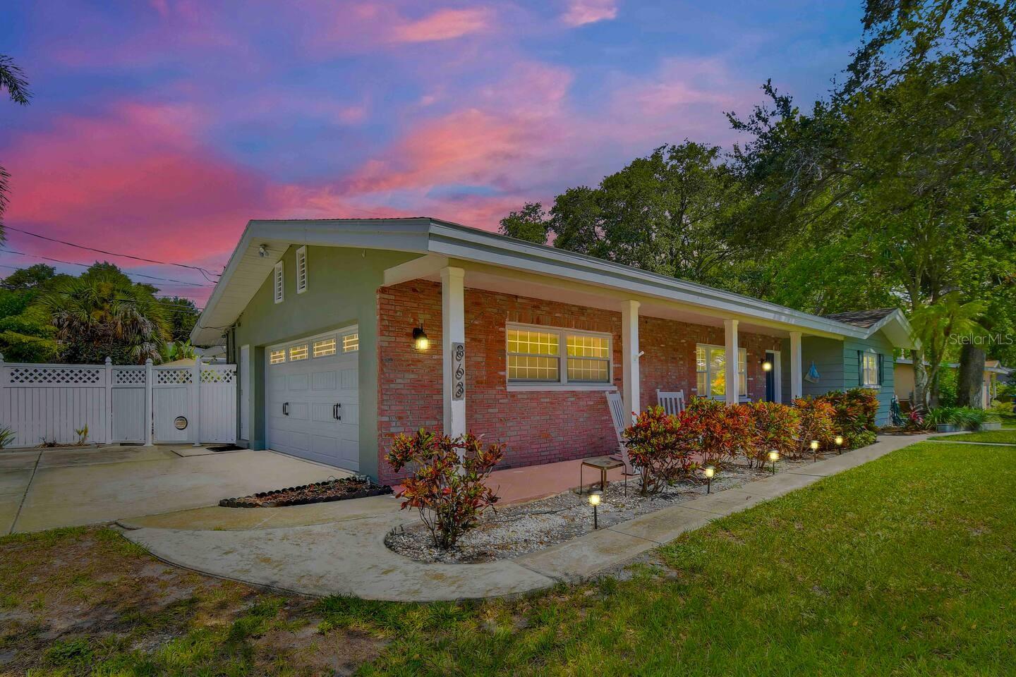 Largo Coastal Country Charm - a stones throw from IRB and Belleair Causeway Boat Ramp nestled on a double lot on a quiet street. This spacious 3-bedroom, 2-bathroom pool home offers over 1,725 sq. ft. of relaxed living space - perfect for families. From the large front porch to the large screened in lanai, ideal for enjoying evening breezes, you’re greeted by a welcoming living room, which leads to an ample space dining room, kitchen, and Florida room. This home features a primary bedroom, with views of the sparkling pool, and boasts a spacious walk-in closet with an updated ensuite bath, including a walk-in shower and jetted tub. The kitchen is a coastal dream, featuring newly installed stone countertops, a fresh new sink and faucet, stainless steel appliances, and a pantry for all your storage needs. Two more bedrooms and a full hall bath complete the home in this split floor plan. Additional features include a large oversized 2-car garage, and large screened in lanai—ideal for year-round enjoyment. Located in a non-flood zone, brings peace of mind. This home offers the perfect balance of privacy and convenience. 1 mile to Taylor Park, easy access to downtown Largo including Largo Central Park, healthcare facilities, and an easy commutes to the cities of Clearwater Beach, St. Petersburg, PIE Airport and Tampa International Airport. You’re just a breezy drive away from catching your own ocean breeze at Bay Breeze Terrace. Schedule your showing today. *Option to purchase fully furnished.