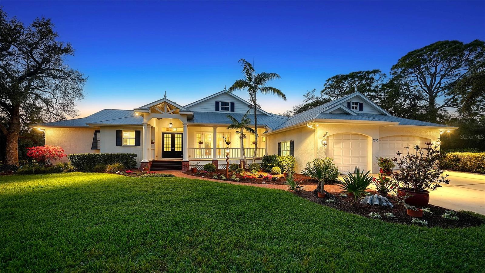 Exquisite custom-built coastal home situated in a small, secluded waterfront gated community. Nestled on a gorgeous nearly three-quarters of an acre lot with 194 feet of private water frontage along the serene Phillippi Creek. Cruise down the creek to Sarasota Bay for a truly one-of-a-kind experience or simply relax in your private sanctuary surrounded by mature landscaping and natural beauty. Spanning over 3,500 SF of interior living space, this 4-bedroom, 3-full bathroom home, plus a dedicated office, is thoughtfully designed for both comfort and entertaining. A welcoming covered front porch with vaulted entry and double doors lead to a grand living room with a soaring vaulted ceiling, eye-catching cultured stone fireplace, custom built-in bookcases and large pocketing sliders opening to the screened lanai with pool and spa. An adjacent formal dining room creates the perfect space for hosting gatherings. The open-concept great room with large pocketing sliders, seamlessly connects to the gourmet kitchen boasting custom cabinetry, under-cabinet lighting, stainless steel appliances, granite countertops, ceramic tile backsplash and a large breakfast bar. The split-bedroom floorplan ensures privacy, with the spacious primary suite tucked behind double doors. The suite includes French doors leading to the covered deck, a large walk-in closet, and an ensuite bath with dual vanities, large walk-in shower, Jacuzzi soaking tub, private water closet, and a linen closet. A private home office, connected to the primary suite and behind double pocket doors, offers a quiet workspace or additional flexible living space. Three additional bedrooms and two full bathrooms are thoughtfully located on the opposite side of the home. Outdoor living is taken to the next level with a large, screened lanai, pool and spa with a tranquil fountain, and a full-length of home covered deck with an outdoor kitchen, perfect for al fresco dining and entertaining. Lush landscaping provides the ultimate privacy. The partially fenced backyard is ideal for pets and children, while a brick pathway leads to the water frontage with a wood dock, water and electric available. With only two bridges to the Intracoastal Waterway (Roberts Bay), your connection to the water is effortless. Additional highlights: Hurricane shutters, Lauzon hardwood flooring, recessed lighting, window treatments, two-zone A/C system, two water heaters (main replaced in Jan 2025), re-screened pool cage (Nov 2024), large laundry room with newer washer and dryer (2024/2025), and a 3-car garage with ample storage. Located just minutes from the world-renowned Siesta Key Beach and vibrant Downtown Sarasota, this home offers the best of both worlds – seclusion and privacy, yet easy access to shopping, dining, and entertainment. With only 9 homes in this intimate community, you’ll enjoy the rare combination of a tranquil setting and a superior location.