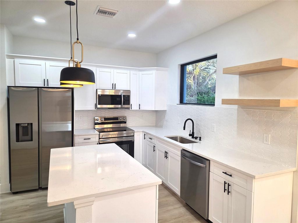 Photo of 1226 Tyrone St, Port Charlotte, FL 33952 (MLS # TB8445868)